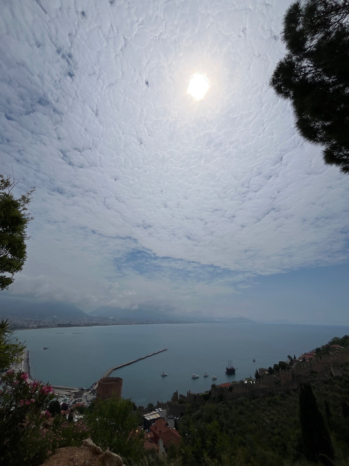 Tourist captures scenic views of Alanya coastline and castle