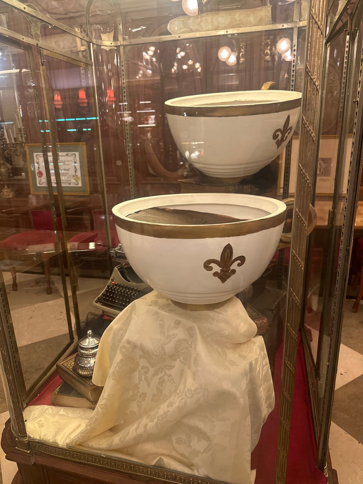 Religious mitres displayed in glass case exhibit