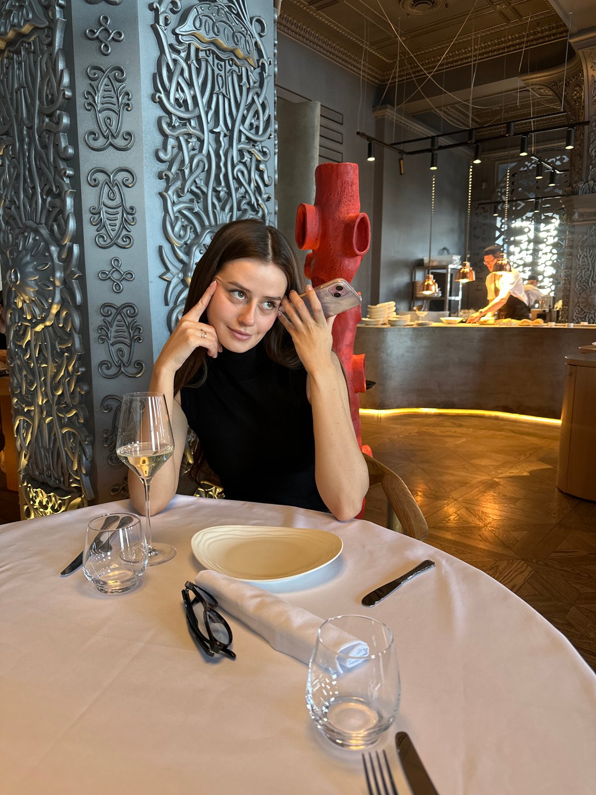 Couple dining at upscale Krasnoyarsk restaurant during morning hours
