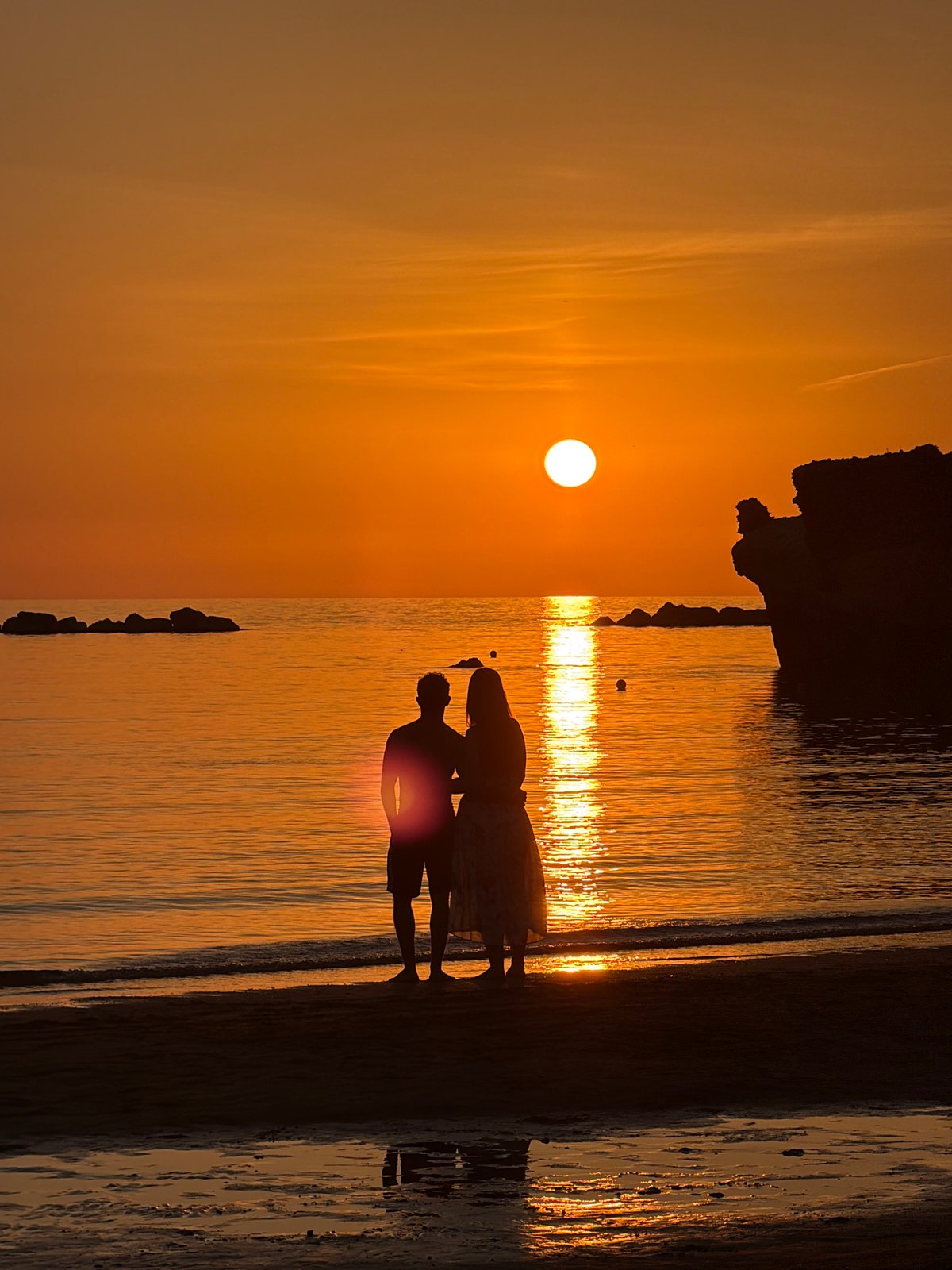 Sunset crowds gather on Anzio's beach along the Tyrrhenian Sea