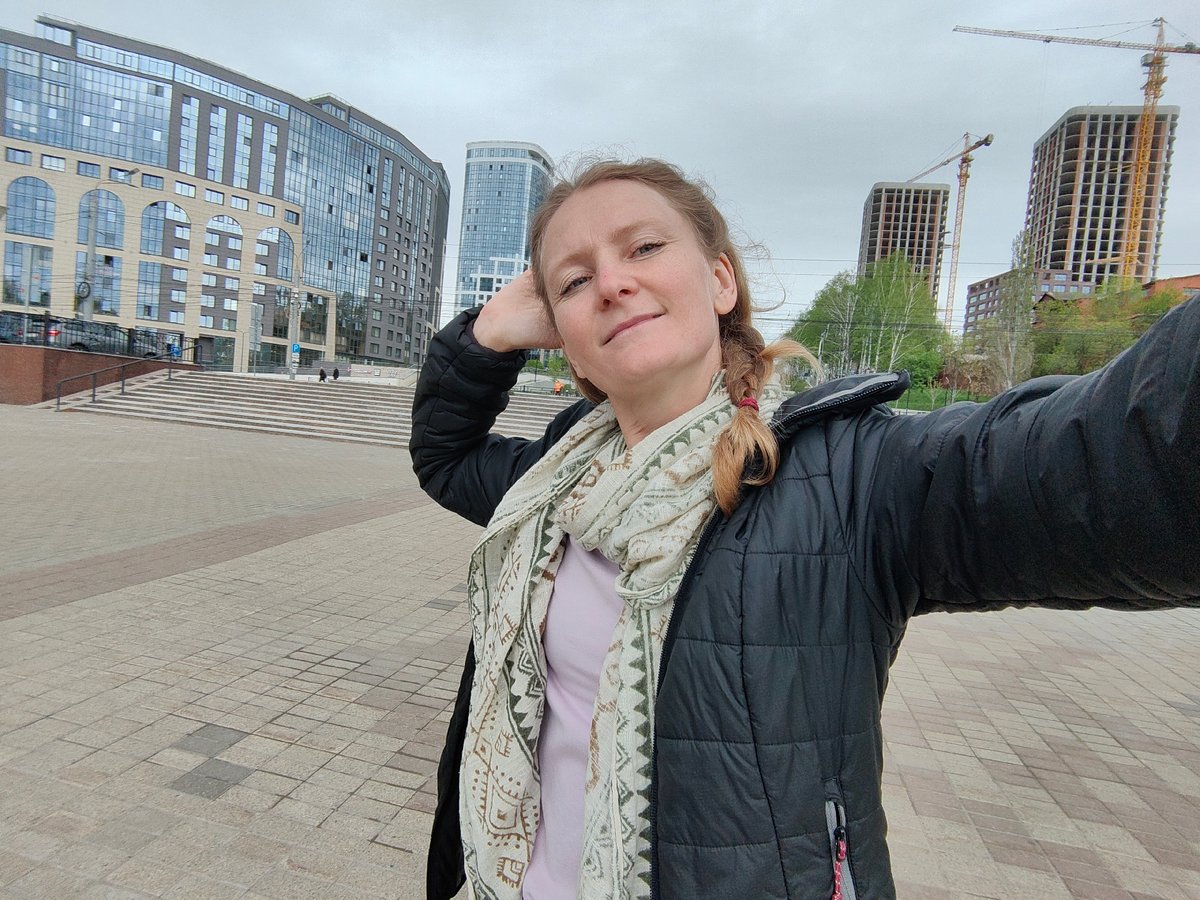 Tourists document Soviet monument and streets in Izhevsk, Russia