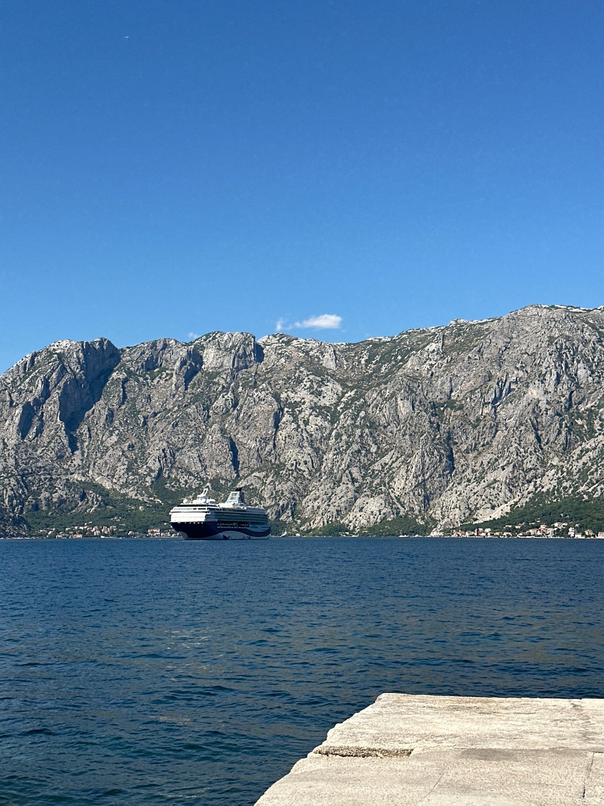 Cruise ship passing through Bay of Kotor's dramatic mountain scenery