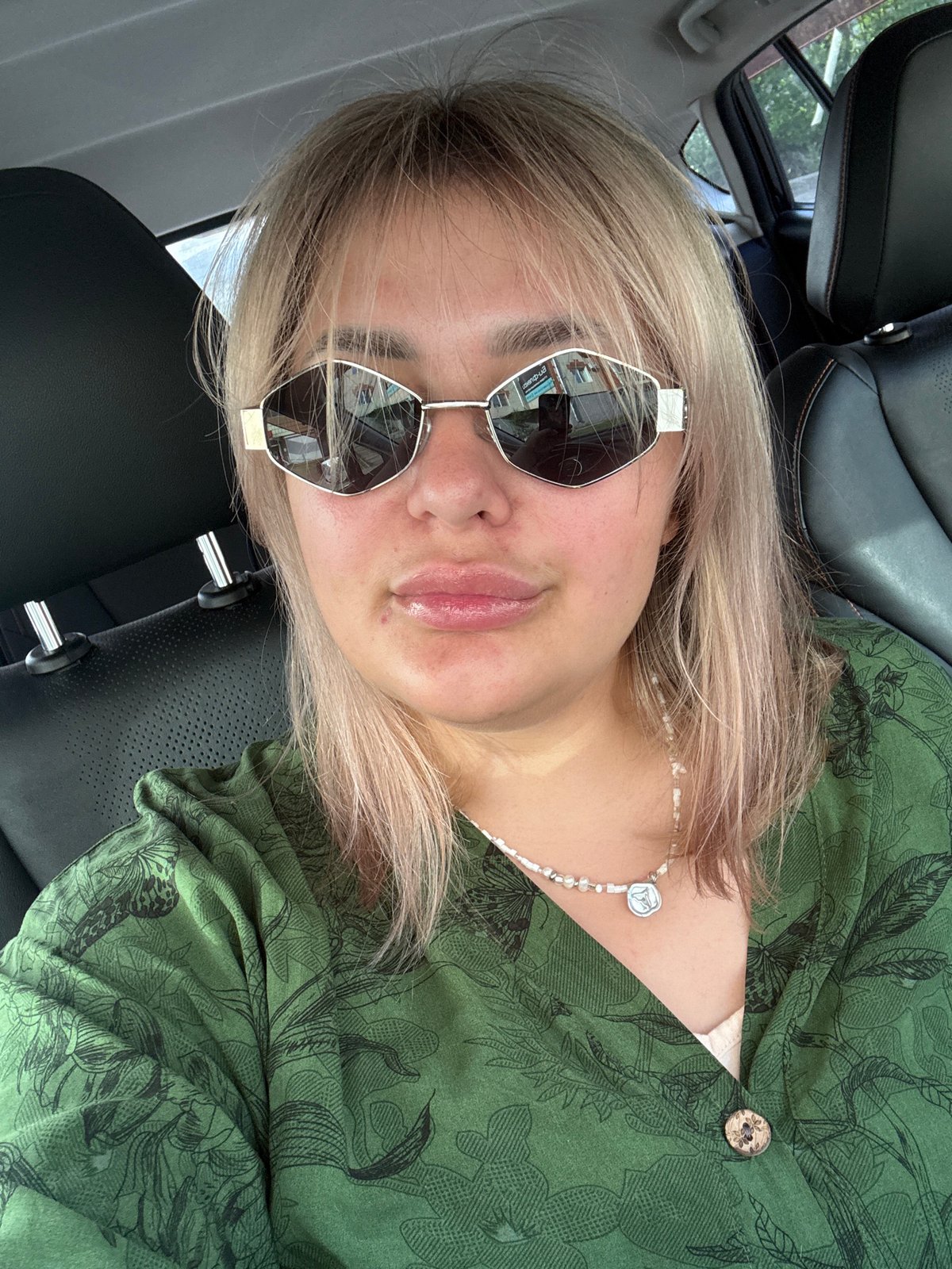 Woman takes selfies in car and outdoors in Birobidzhan