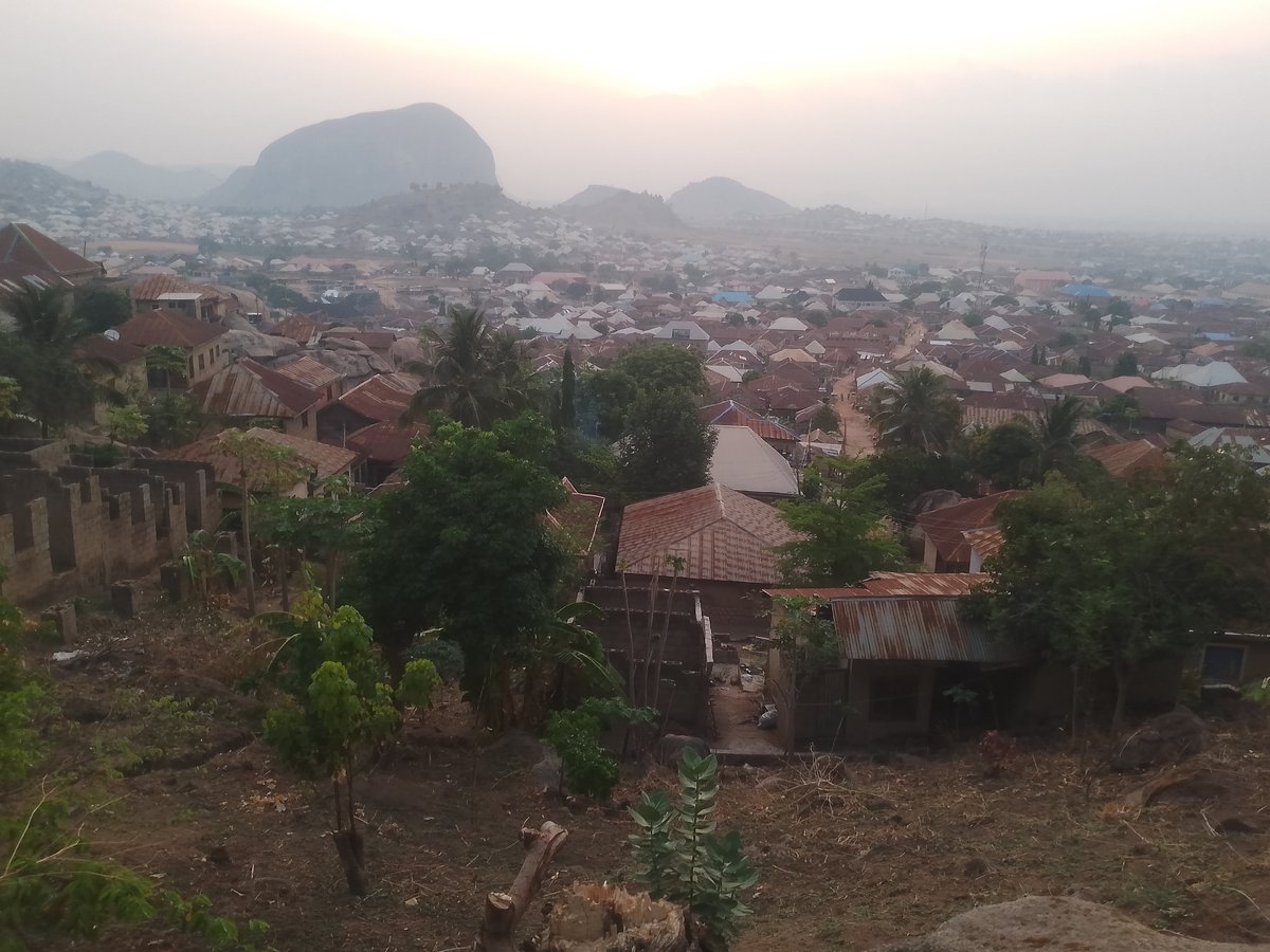 Aerial view captures dense city with mountain backdrop