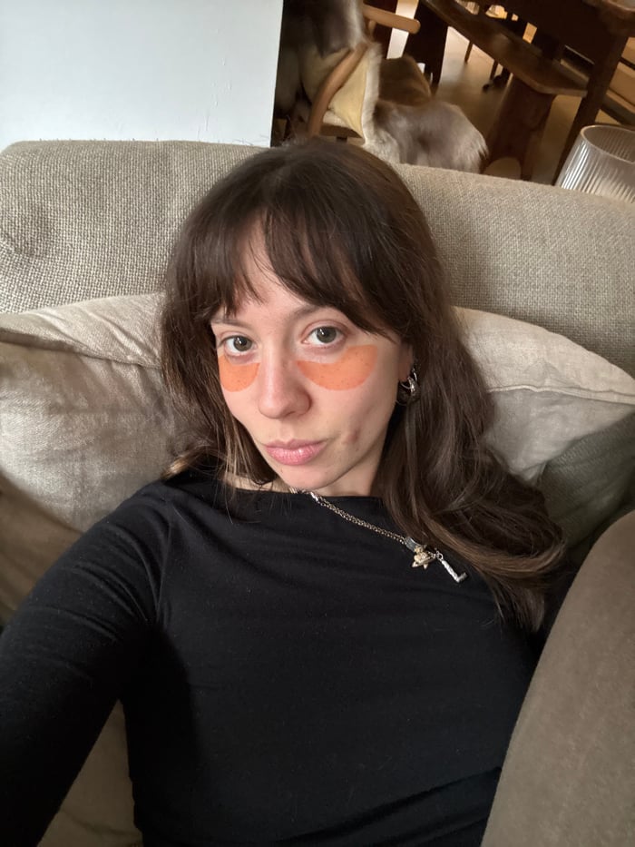 Woman photographed with skincare patches in London's financial district