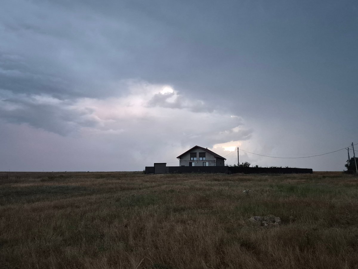 Dusk settles over quiet fields and rooftops in Ceadîr-Lunga