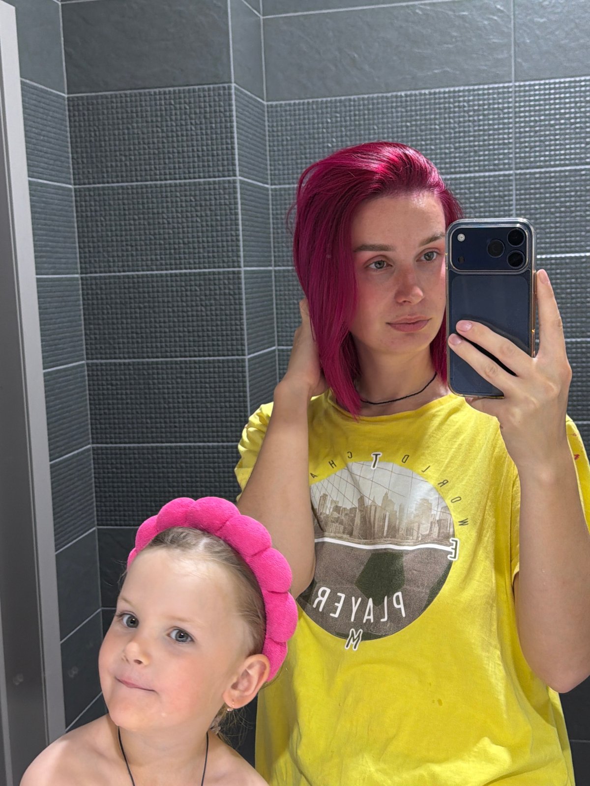 Mirror selfie and face-washing routine in a Chaikovsky bathroom
