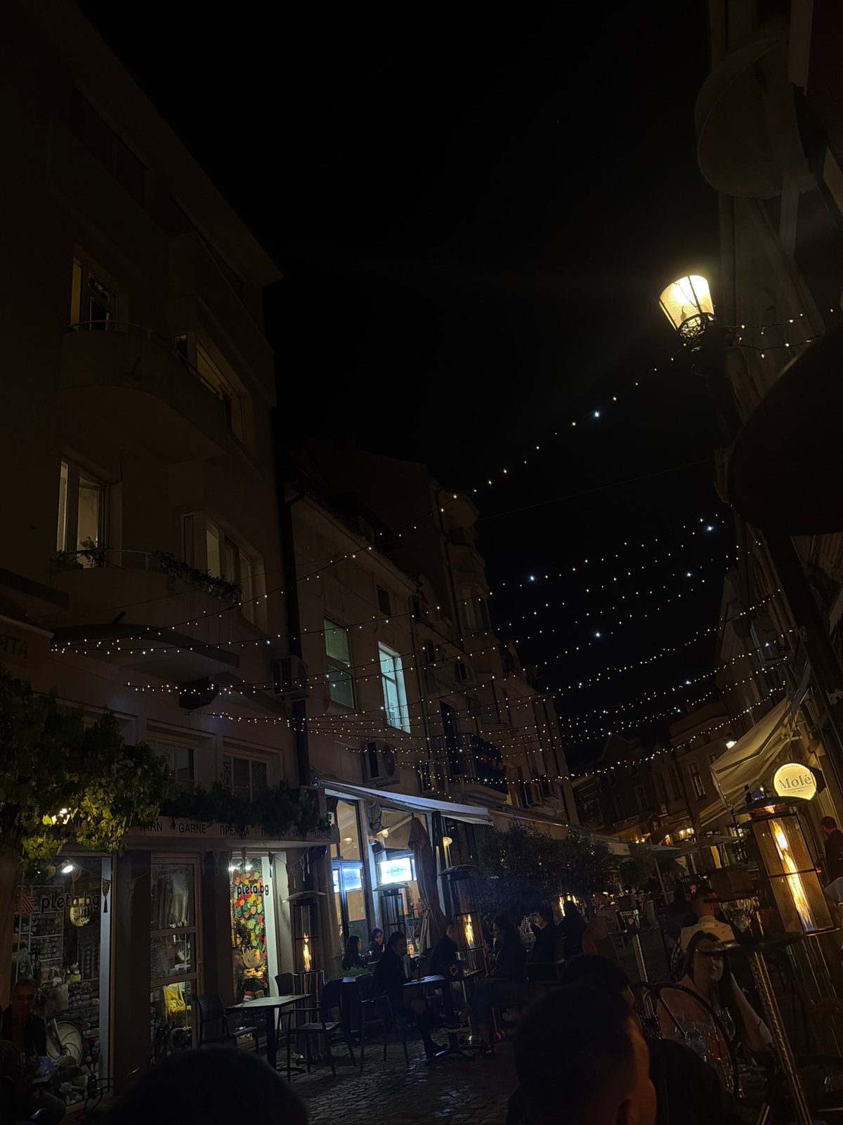 Evening journey through illuminated streets and venues in Plovdiv