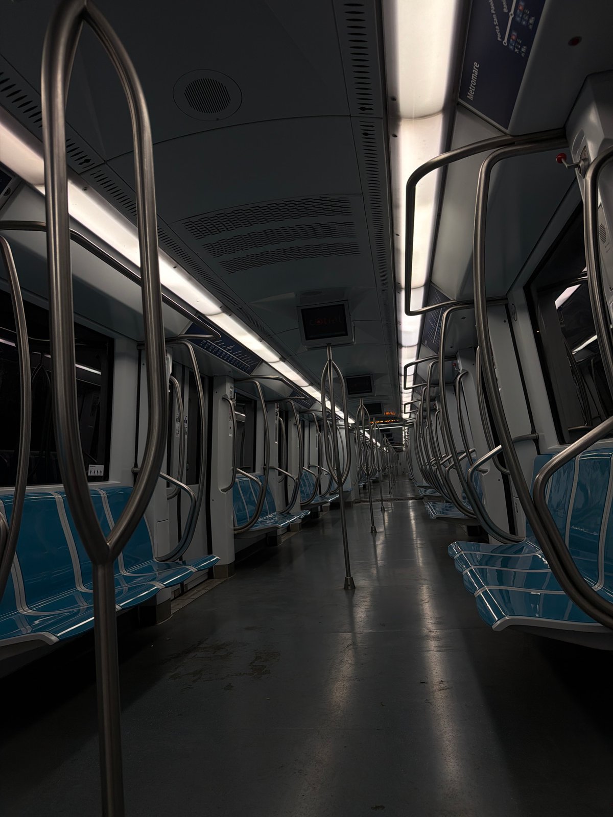 Nearly empty Rome Metro car observed during evening hours