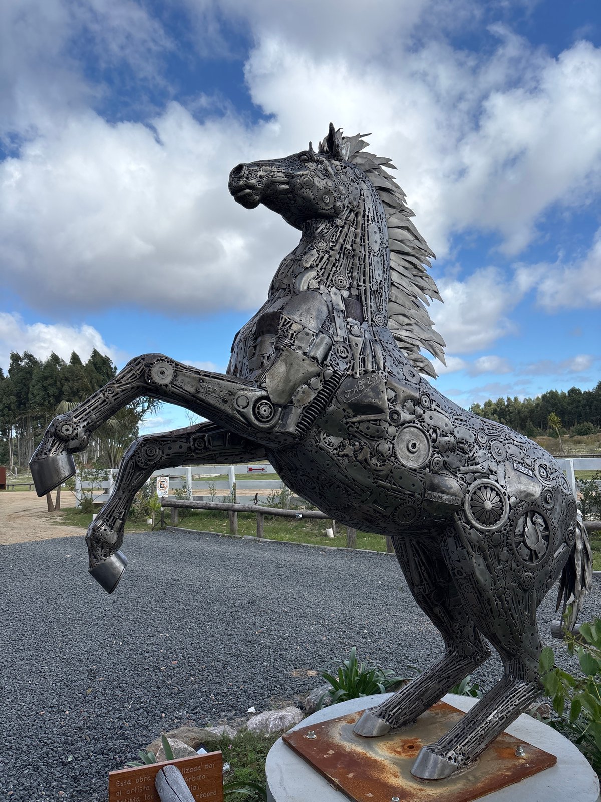 Outdoor sculptures and vintage machinery documented in Marindia, Uruguay