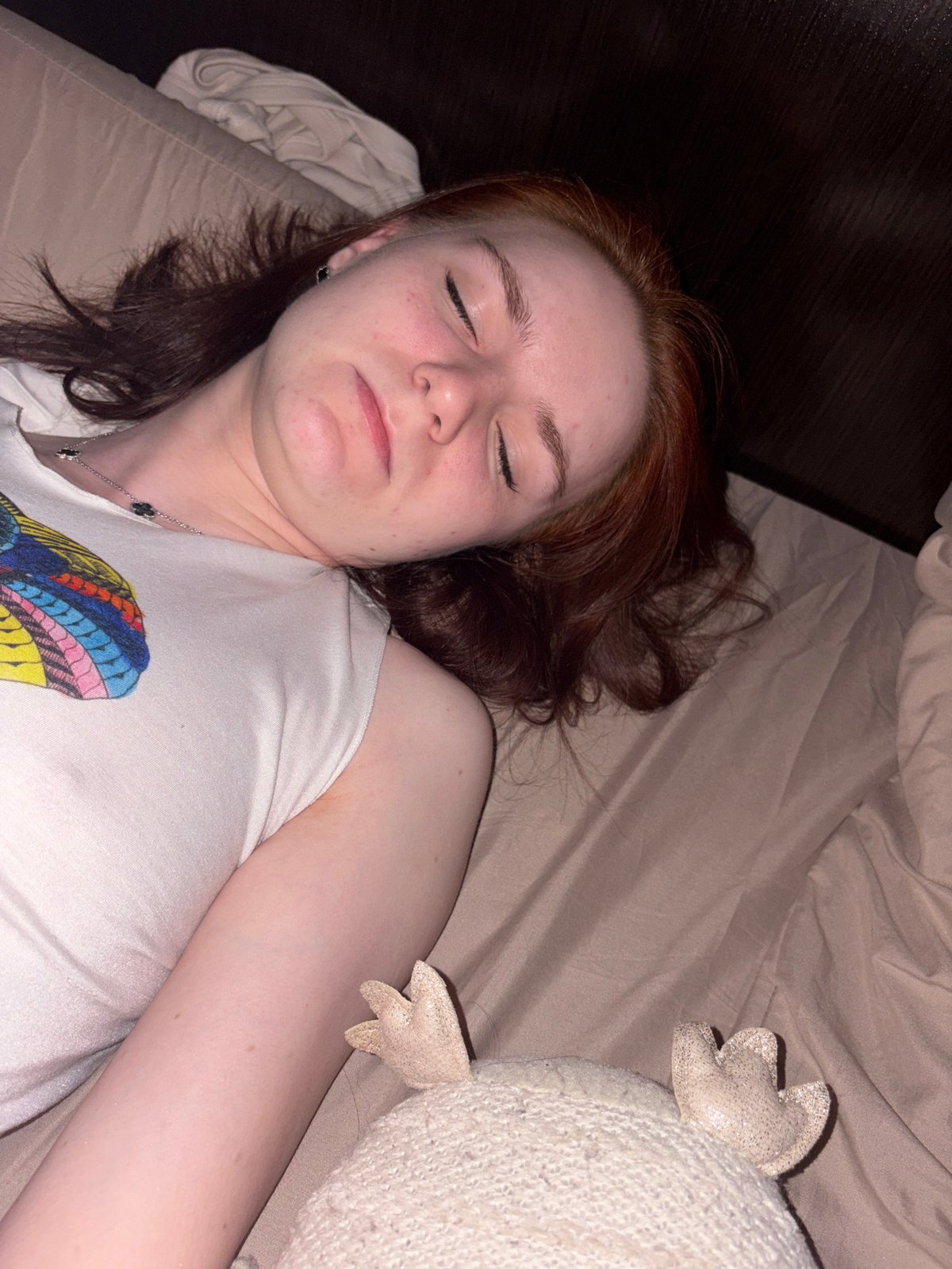 Woman rests on bed during evening hours