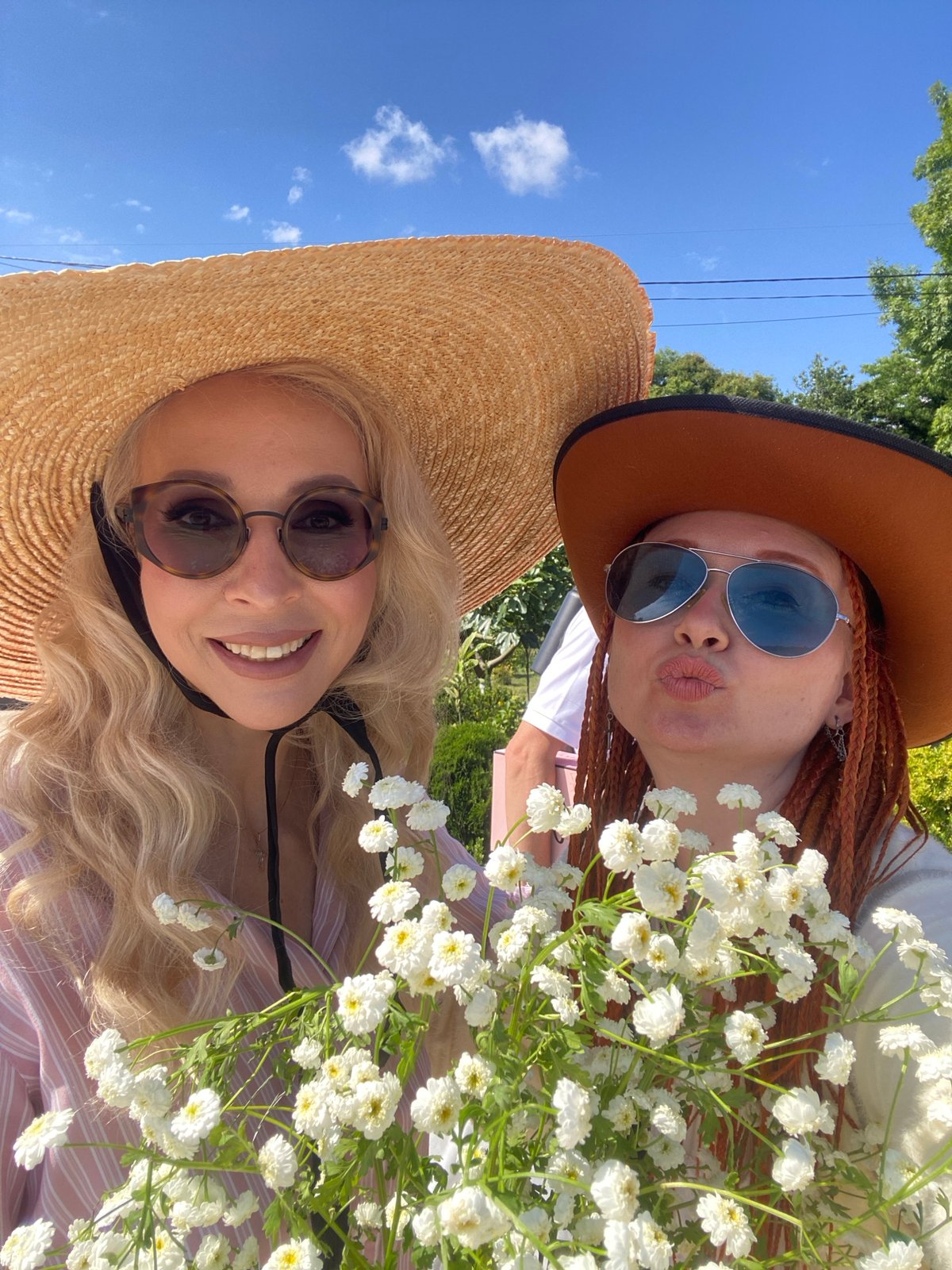 Selfie session in Sochi with hats and flowers