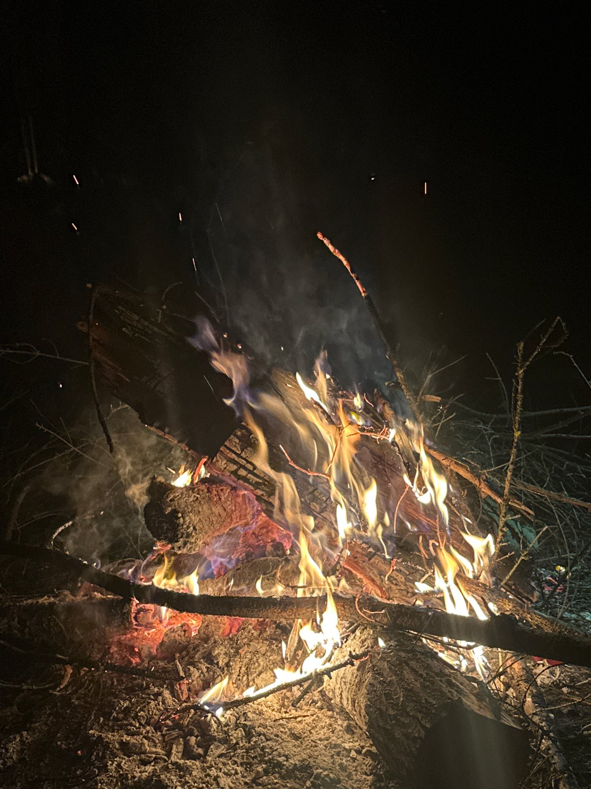 Nighttime campfire gathering documented in rural Belarus village