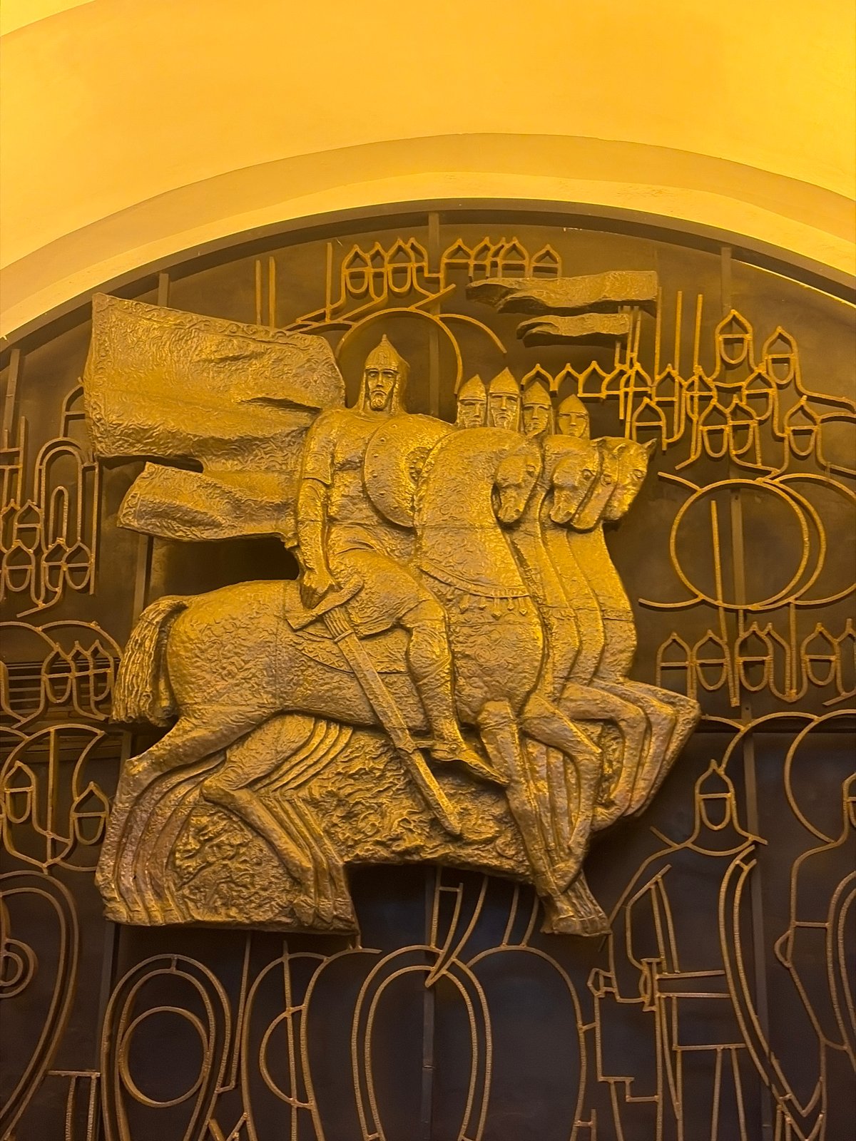 Gold relief sculptures documented at Saint Petersburg metro station