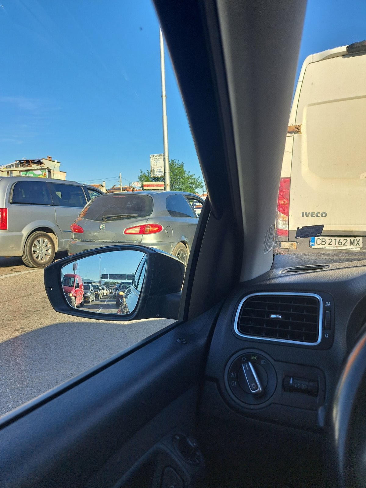 Car ride through traffic jam captured from multiple interior angles