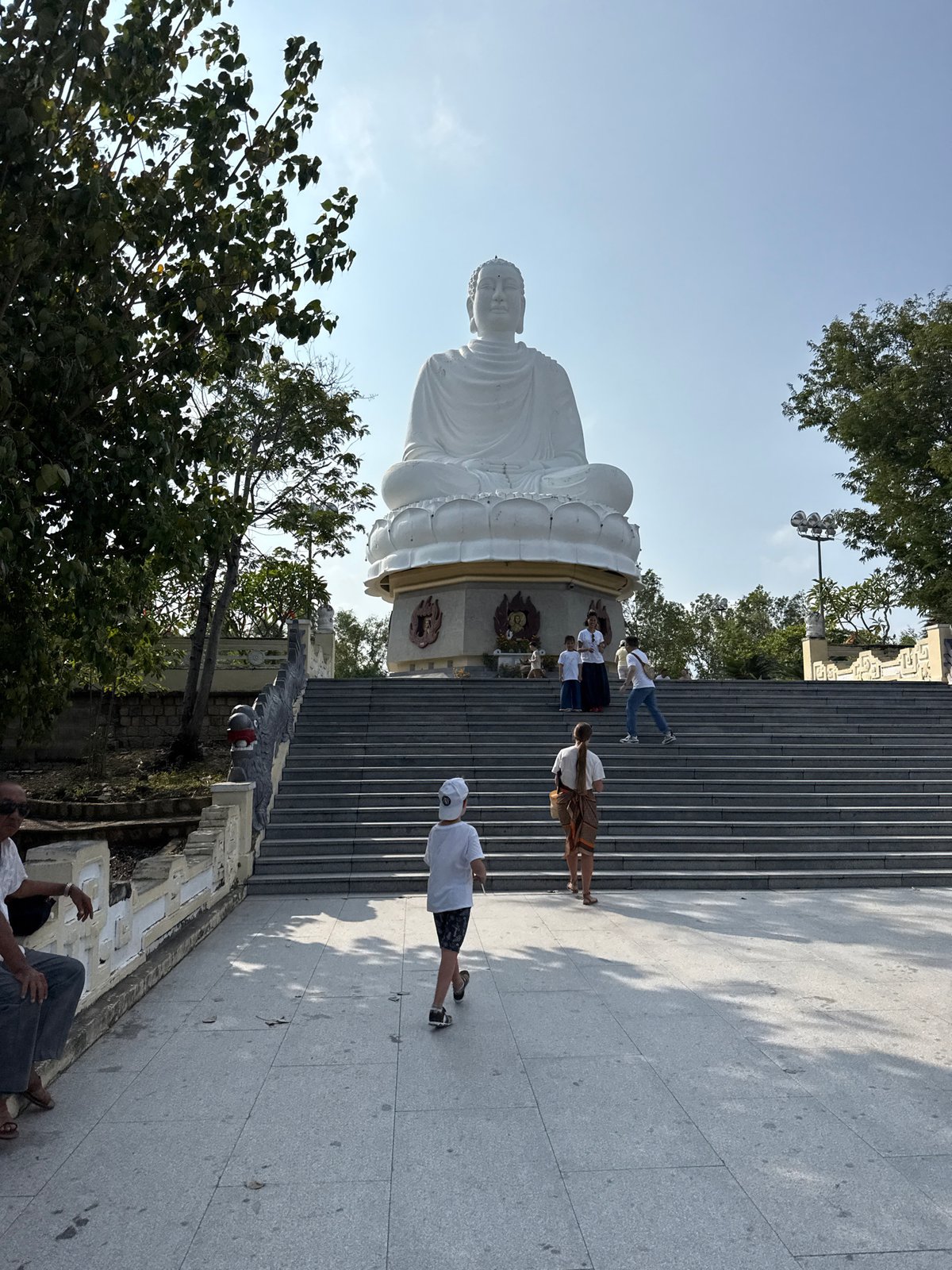 White Buddha statue captured at temple complex in Vietnam