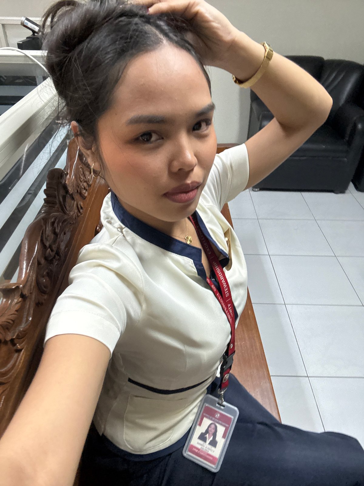 USP students in uniform killing time in a Davao waiting area