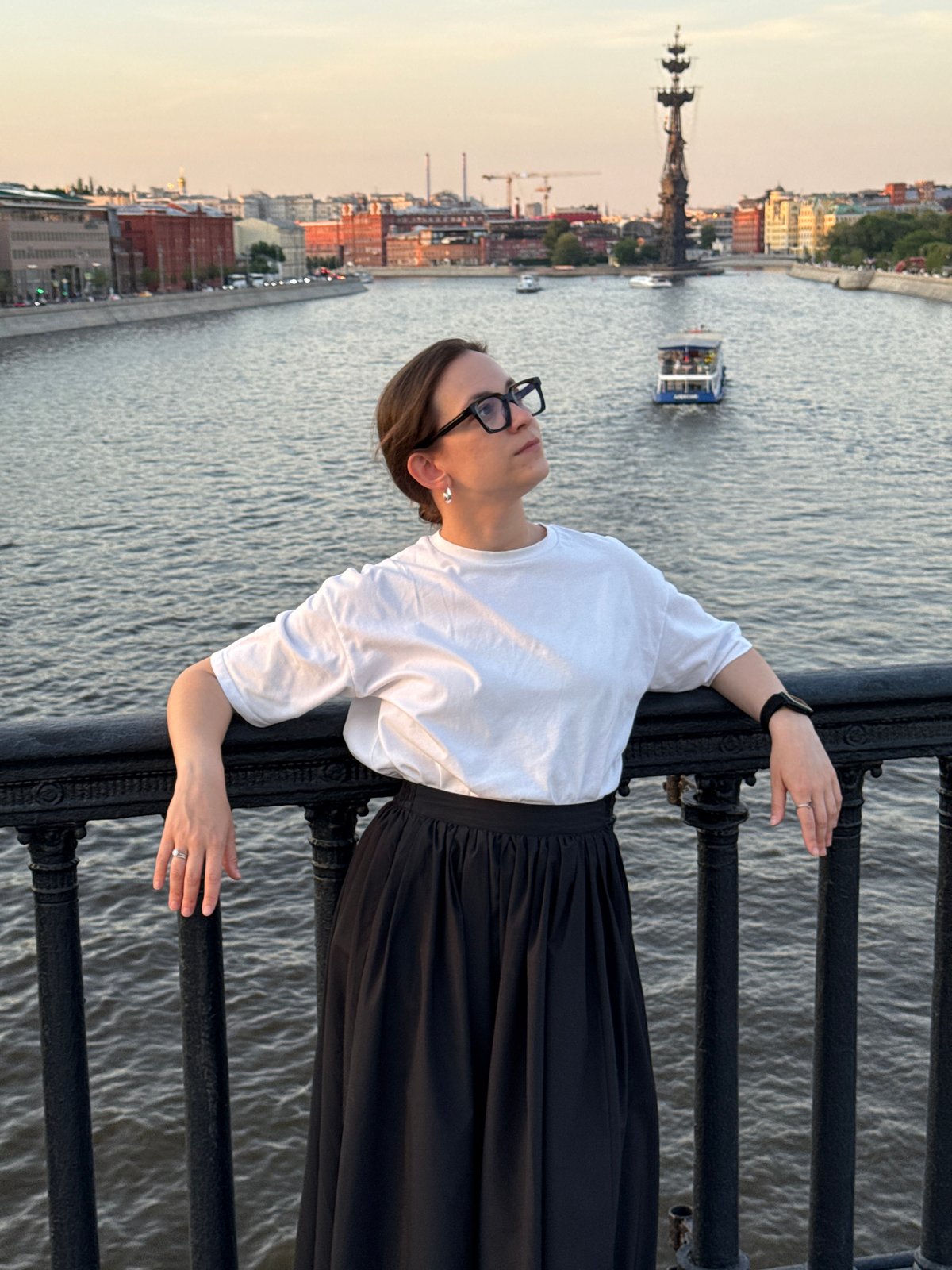 Woman enjoys sunset views from Moscow's Krymsky Bridge