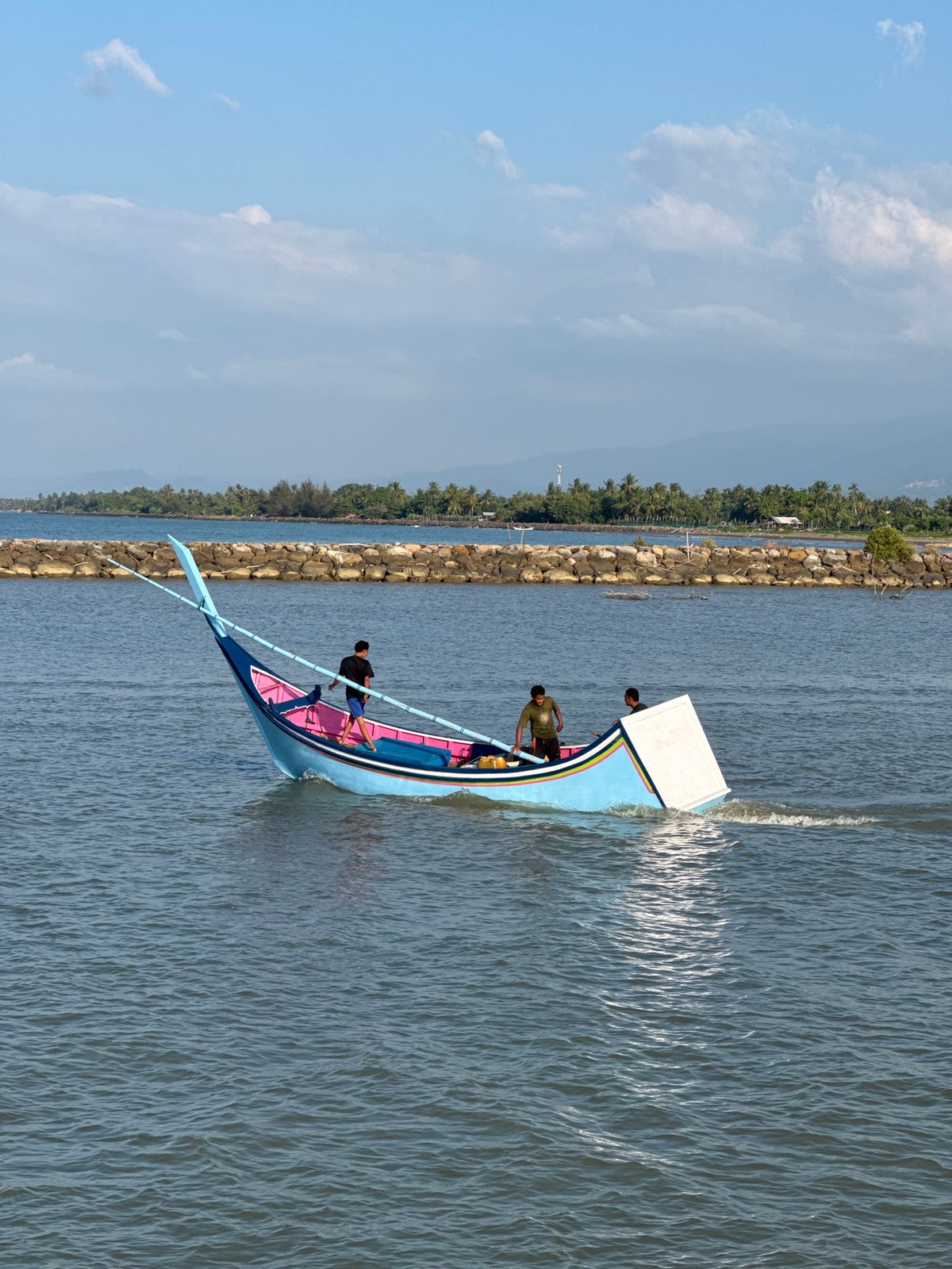 Traditional fishing boats work the waters off Reudeuep, Indonesia