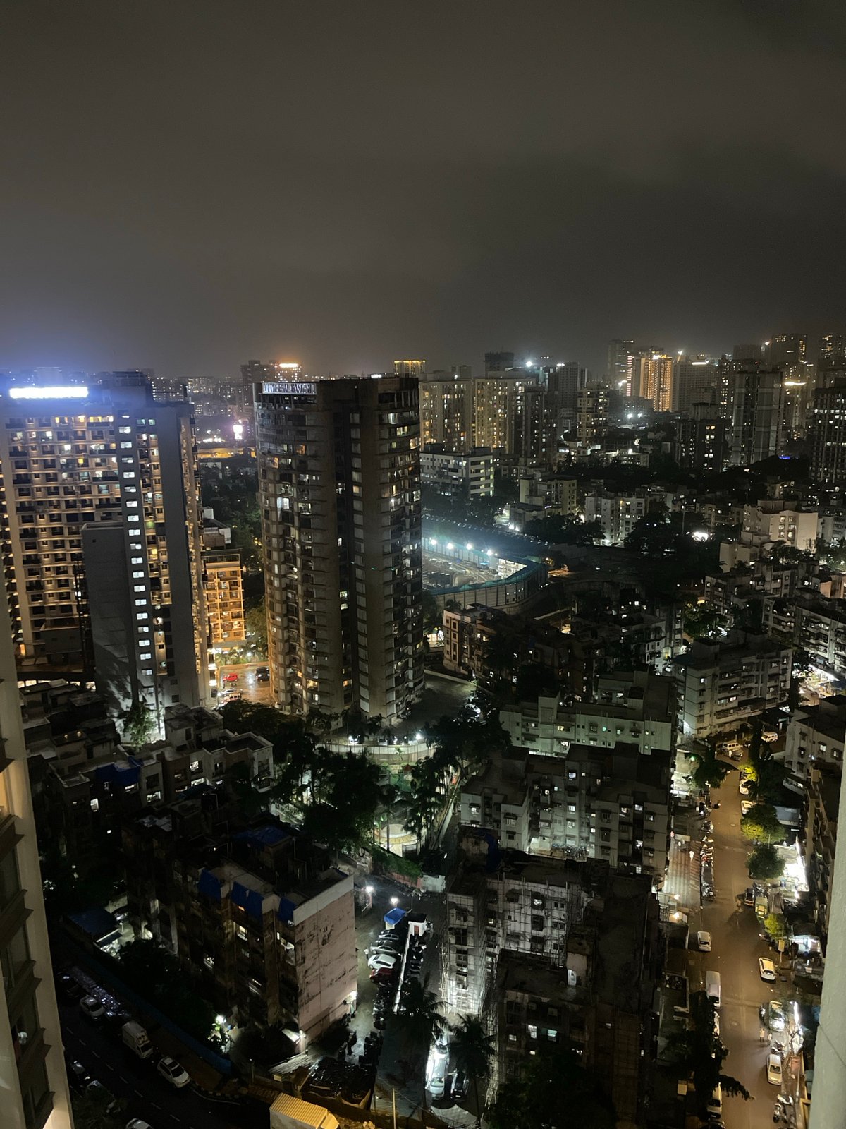 Inside and above Sunteck City during a Mumbai monsoon afternoon