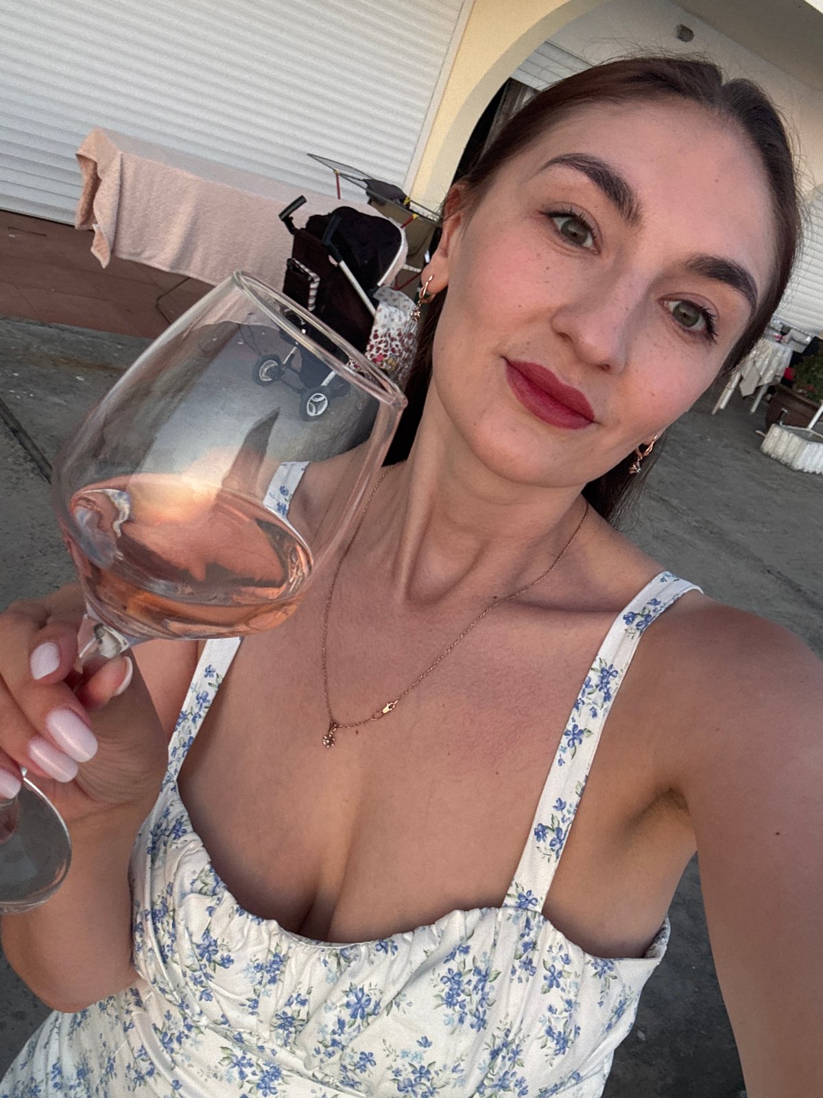 Woman documents sunset wine moment on Sochi beach