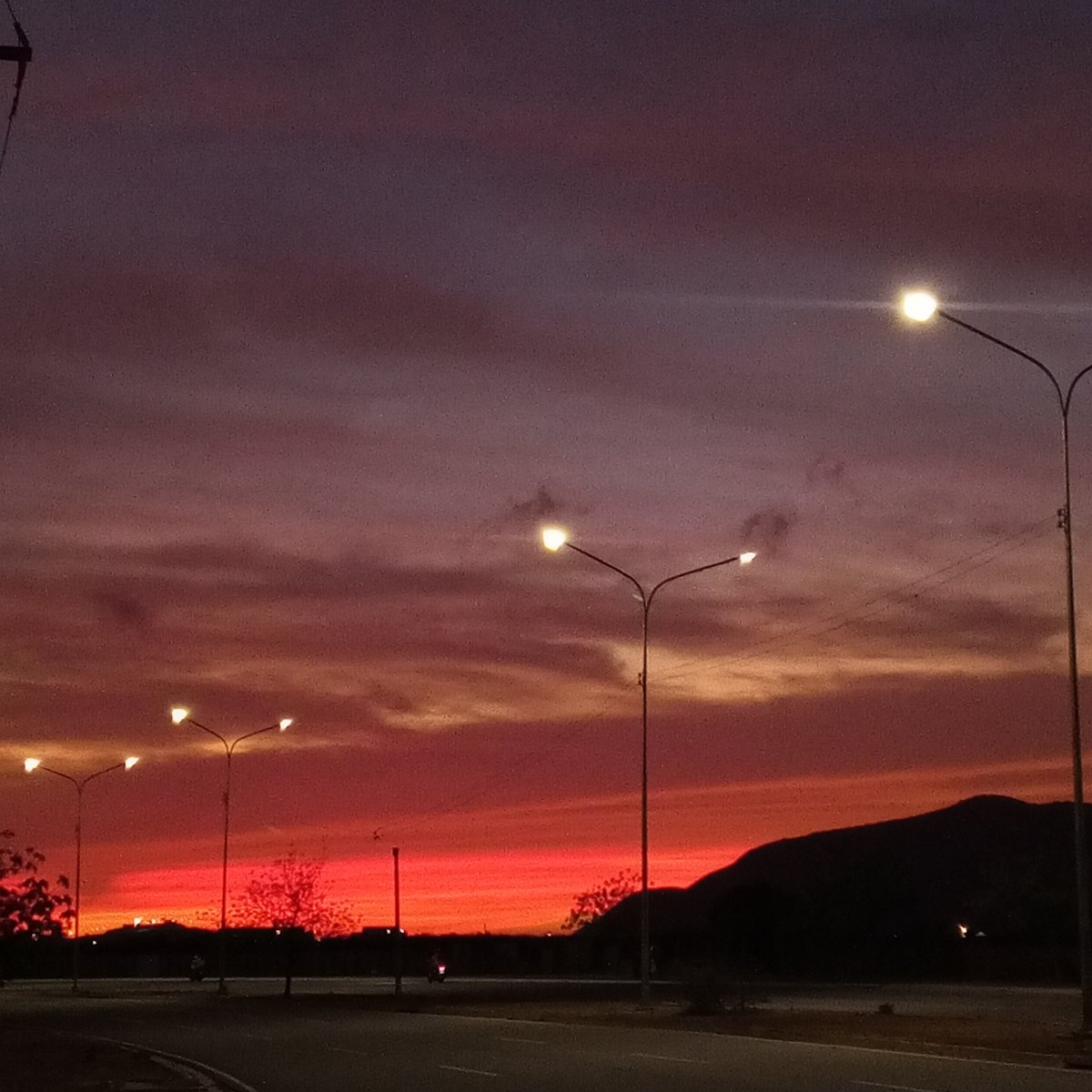 Dramatic sunset documented along roadway by multiple witnesses