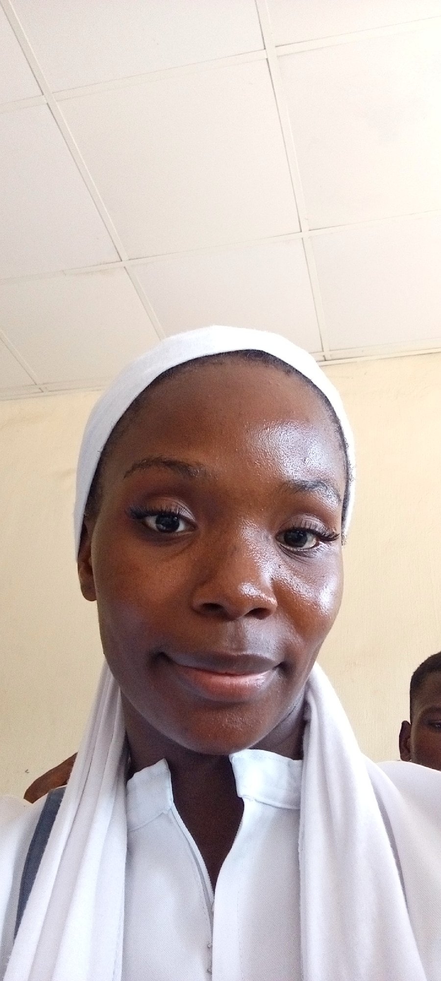 Students in white uniforms attend classroom session in Keffi