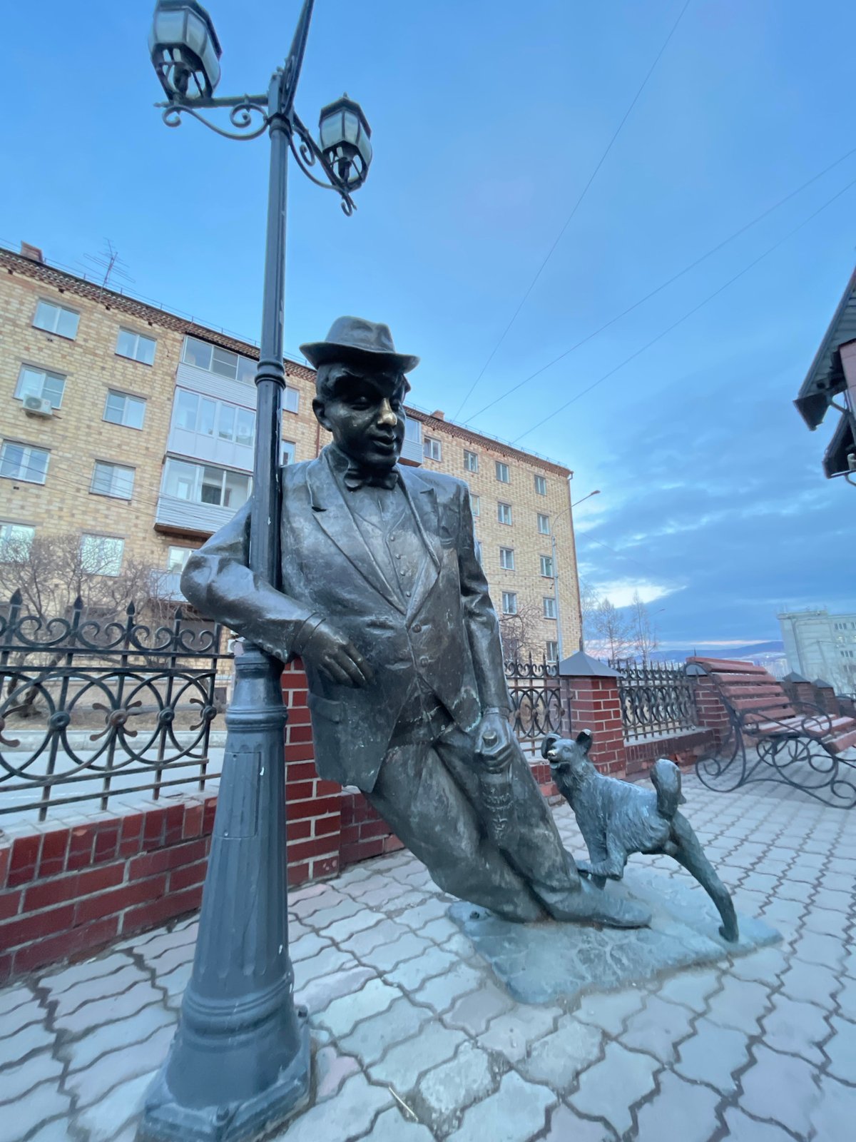 Street monuments documented in Krasnoyarsk including bronze statue, ornate clock