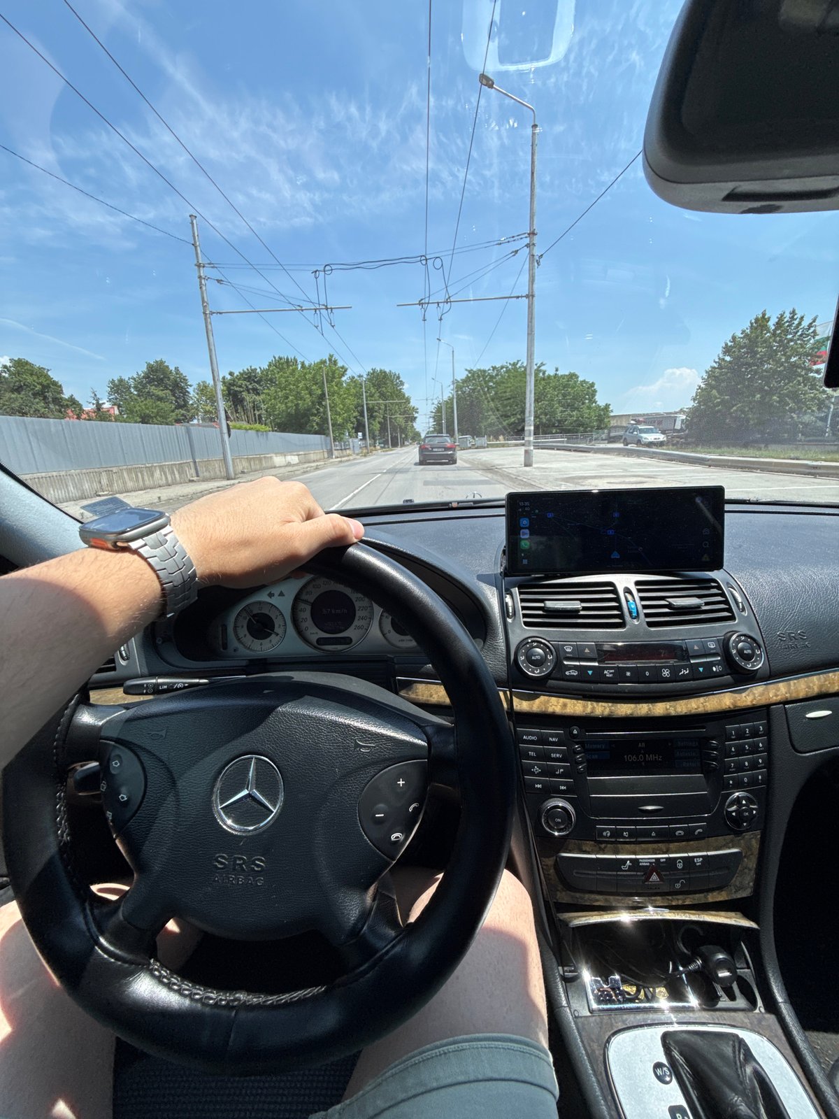 Driver navigates Mercedes through sunny Stara Zagora streets
