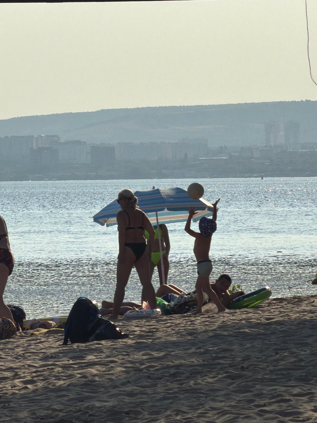 Lazy summer afternoon on the Volga beach in Engels