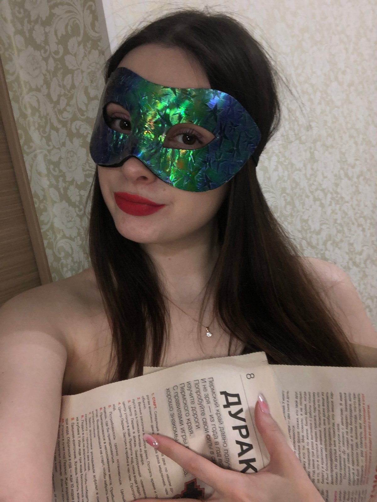 Person takes mirror selfies with accessories in Noviy bedroom
