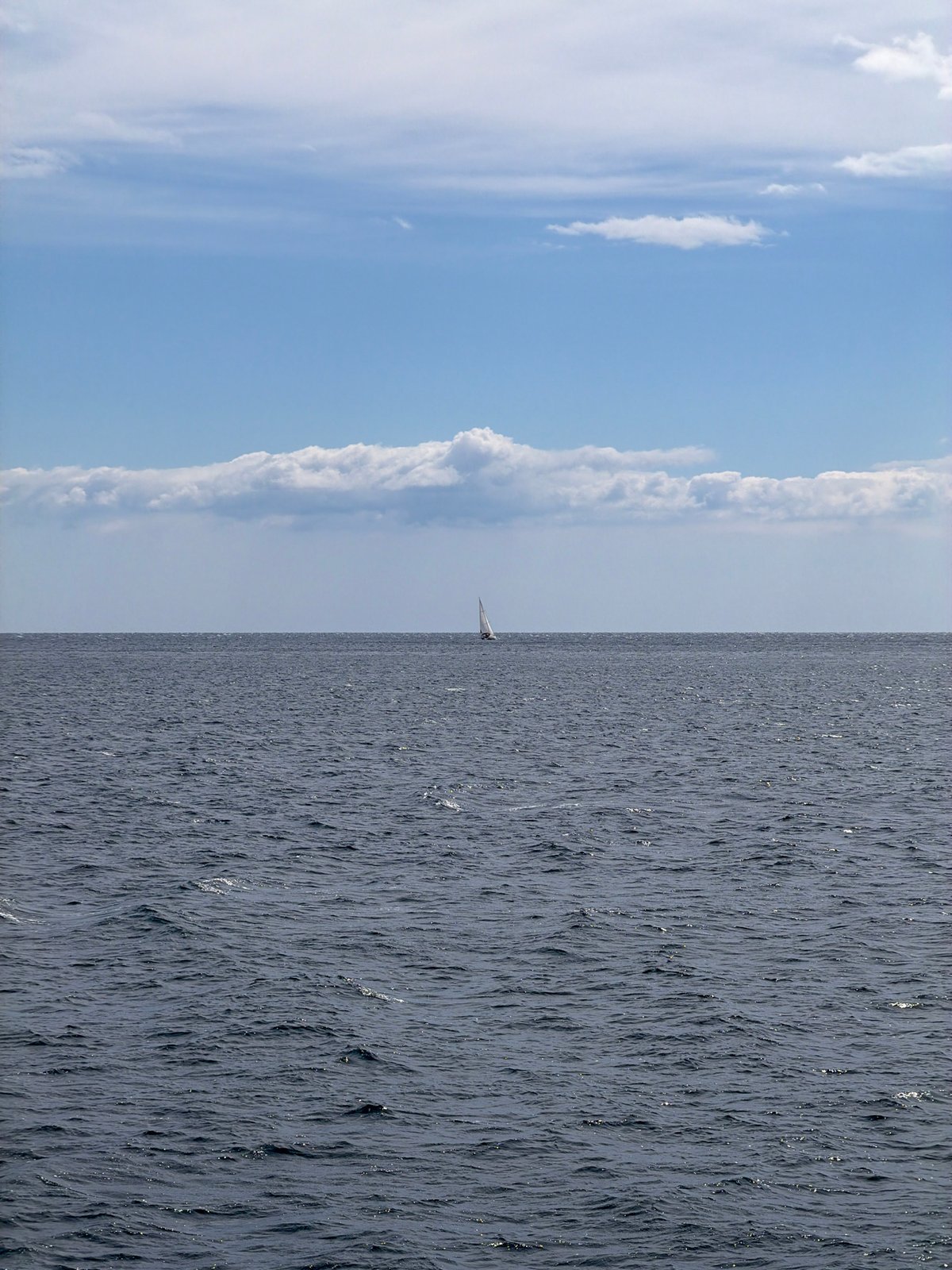 Sailboat spotted under mixed skies off Turkish coast