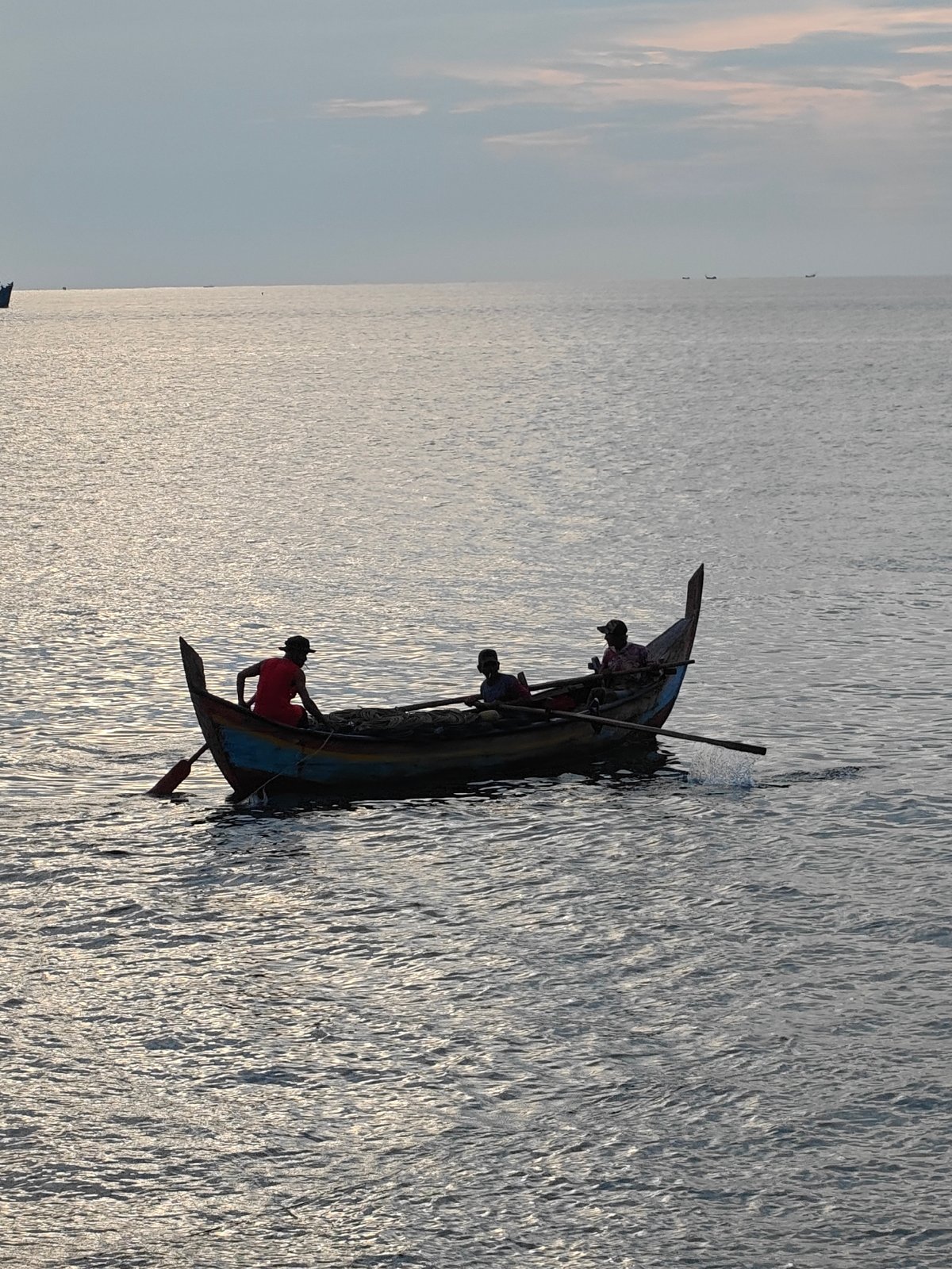 Fishing boats and quiet shoreline life off Lhokseumawe coast