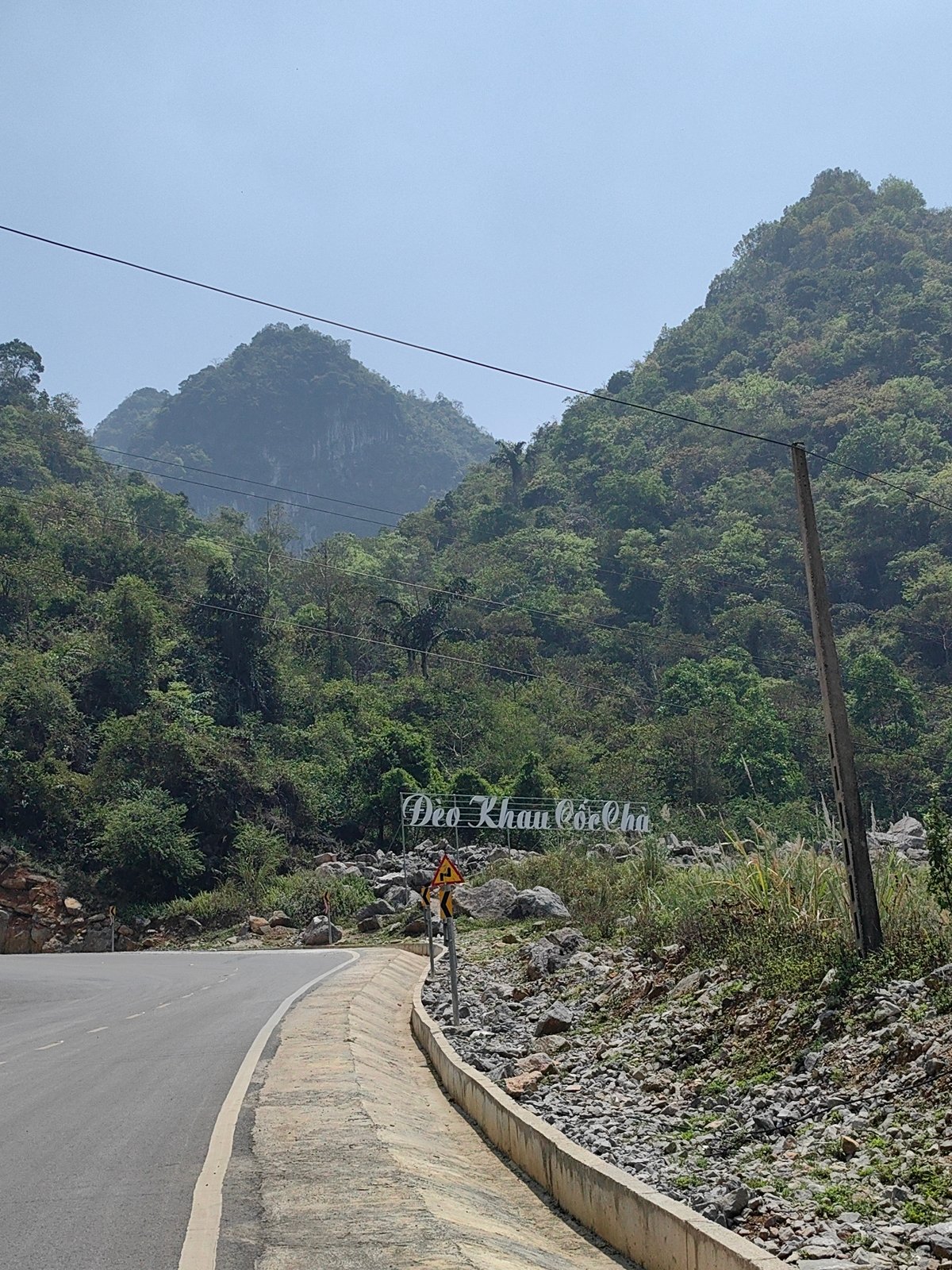 Traveler documents scenic mountain pass road in northern Vietnam