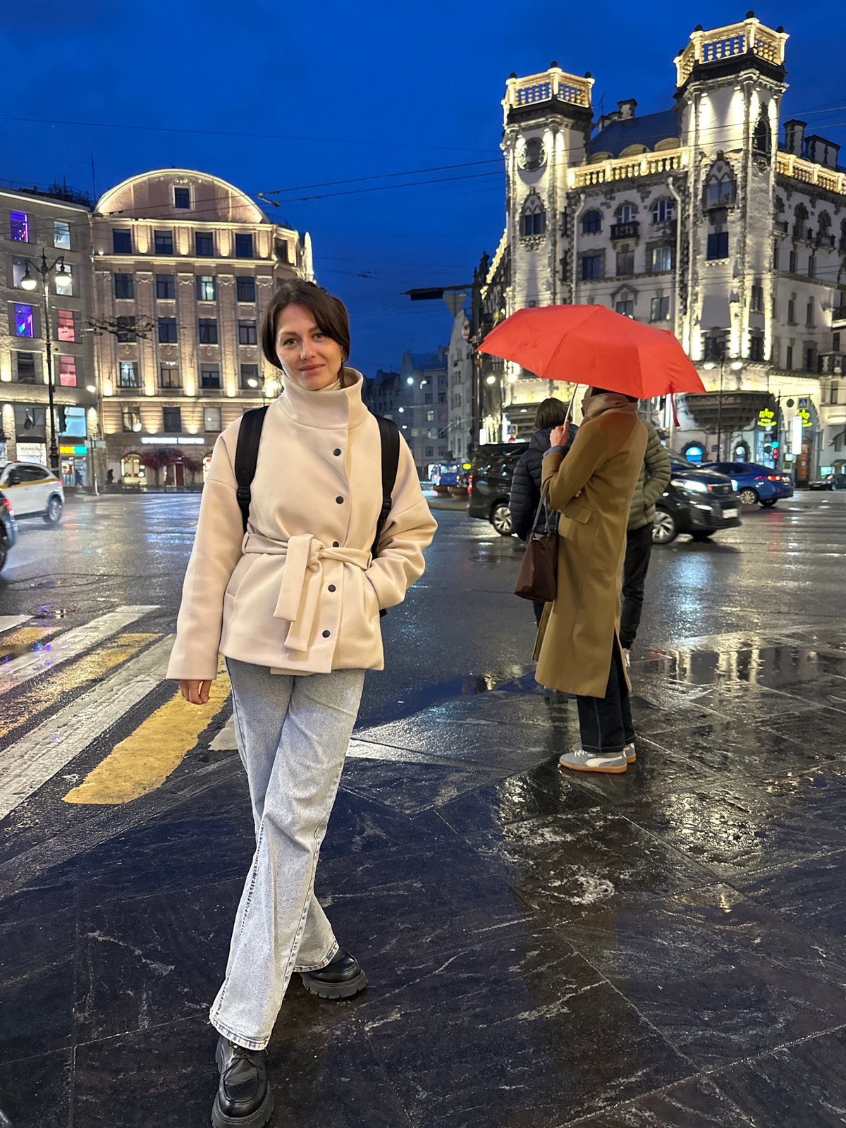 Woman observed on rainy Saint Petersburg street Saturday evening