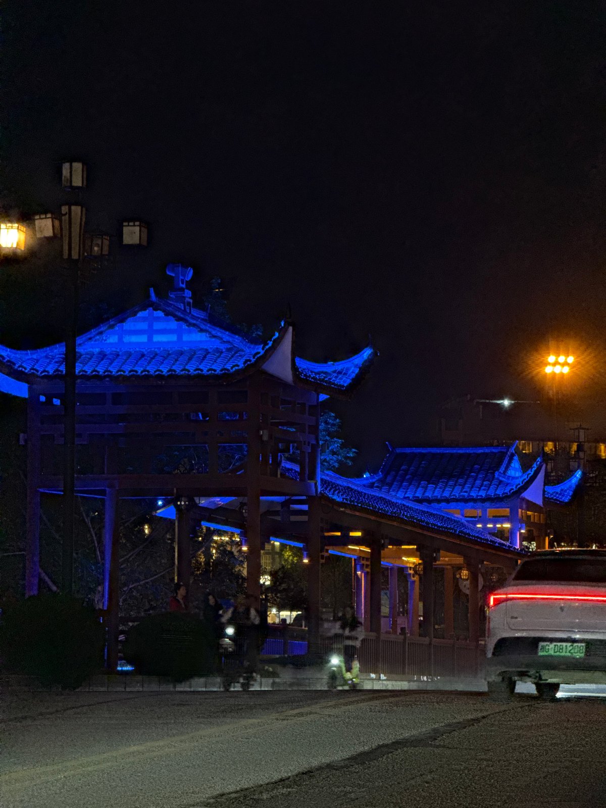 Traditional Chinese pavilions illuminated at night in Wulingyuan