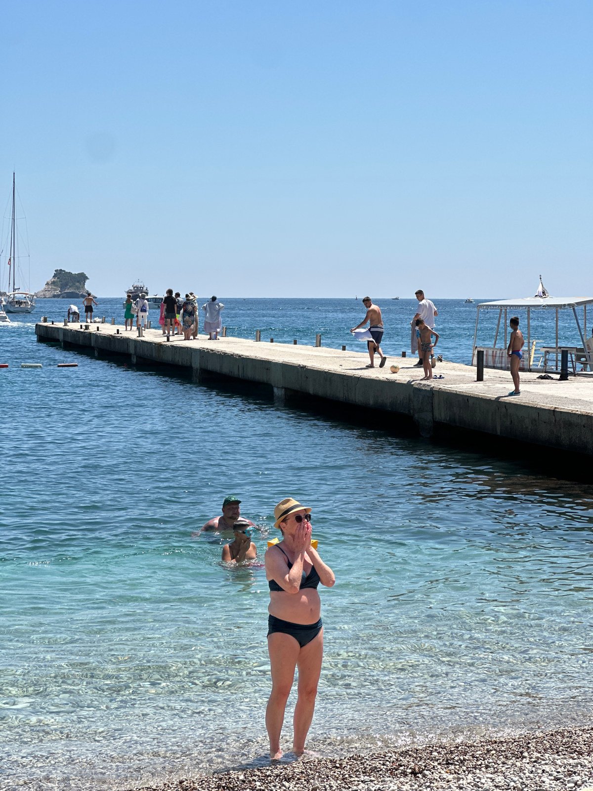 Sunny beach day captured at Budva pier, Montenegro