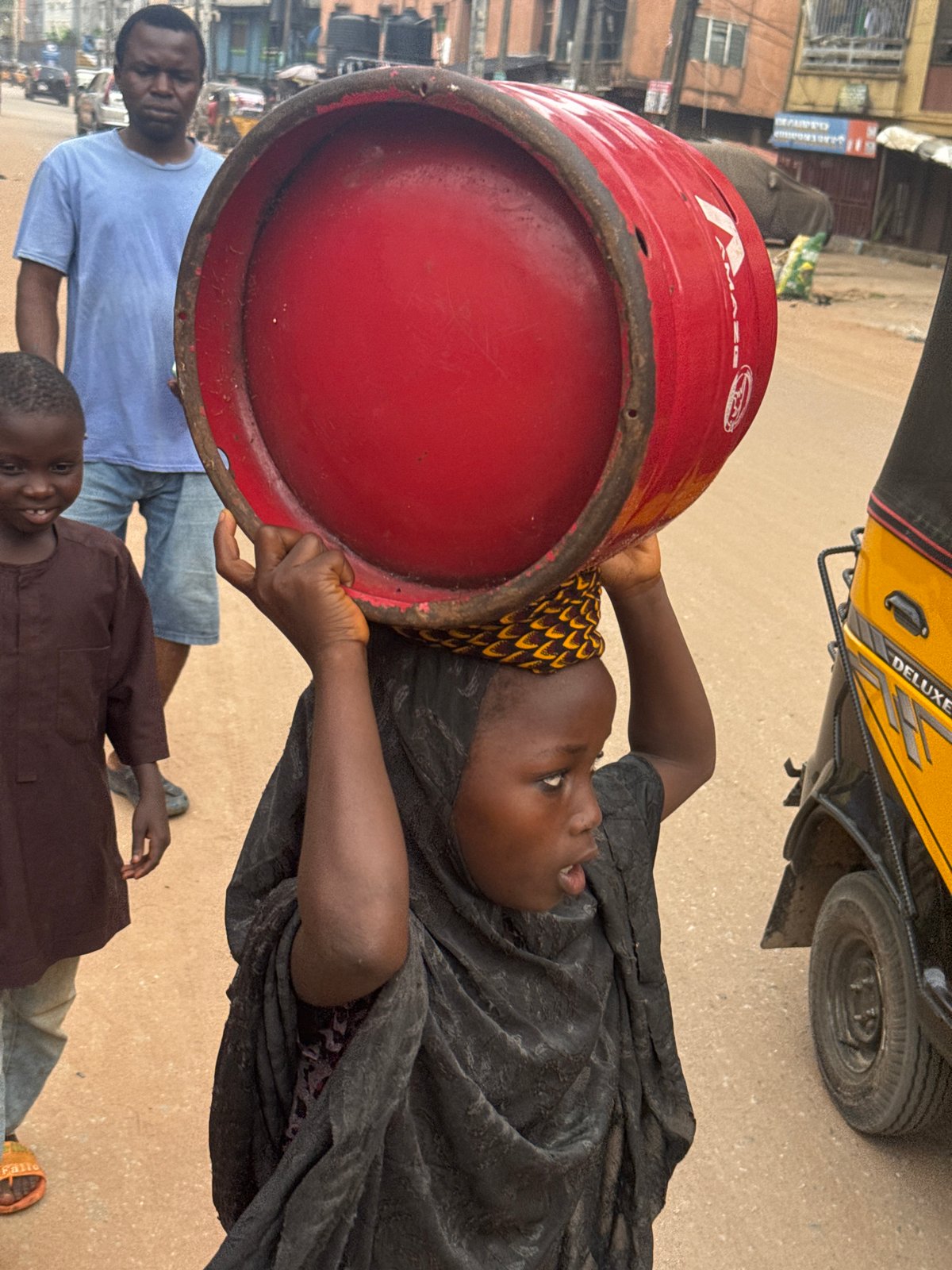 Street life and commerce along a busy Onitsha road