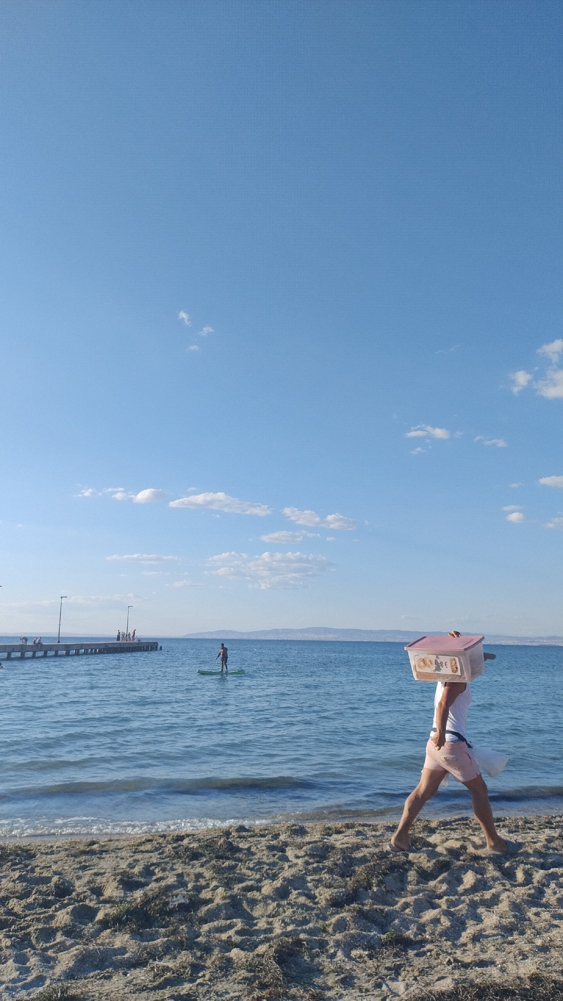 Beachside vendor and selfie moment in Perea, Greece