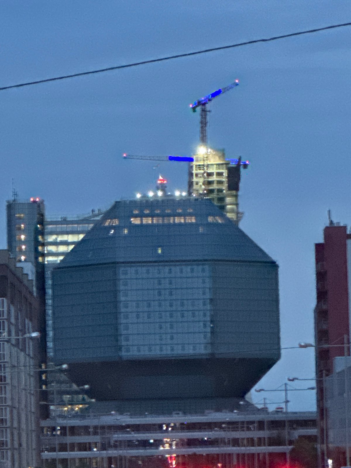 Evening scenes documented across Minsk including library, buildings, helicopter