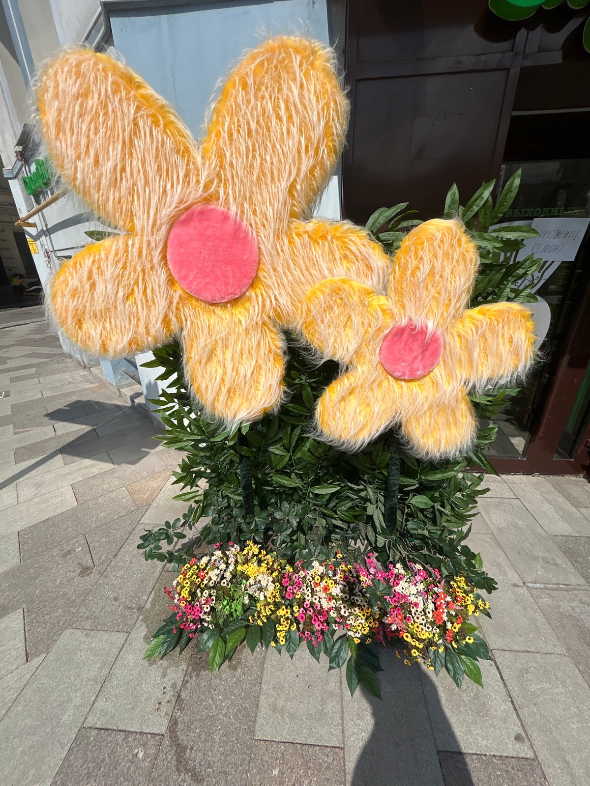 Large Yellow Fabric Flowers Spotted on City Street