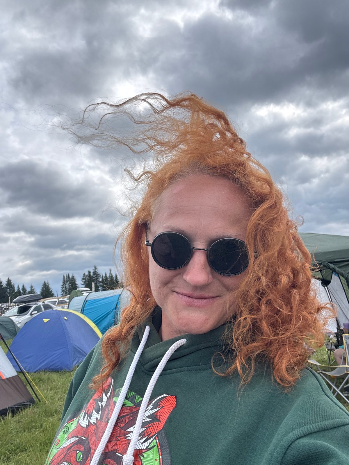 Woman photographed at outdoor gathering in rural Russia
