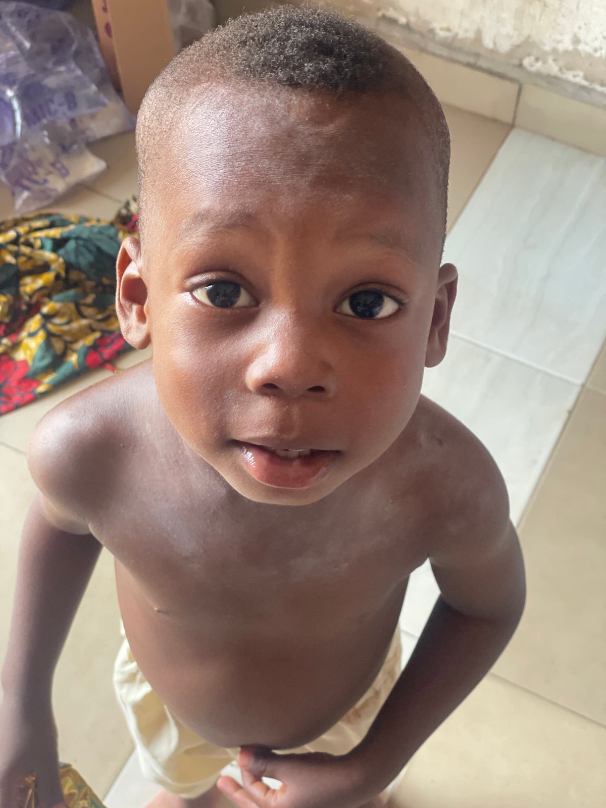 Child photographed in multiple portraits over 9 minutes in Lokoja