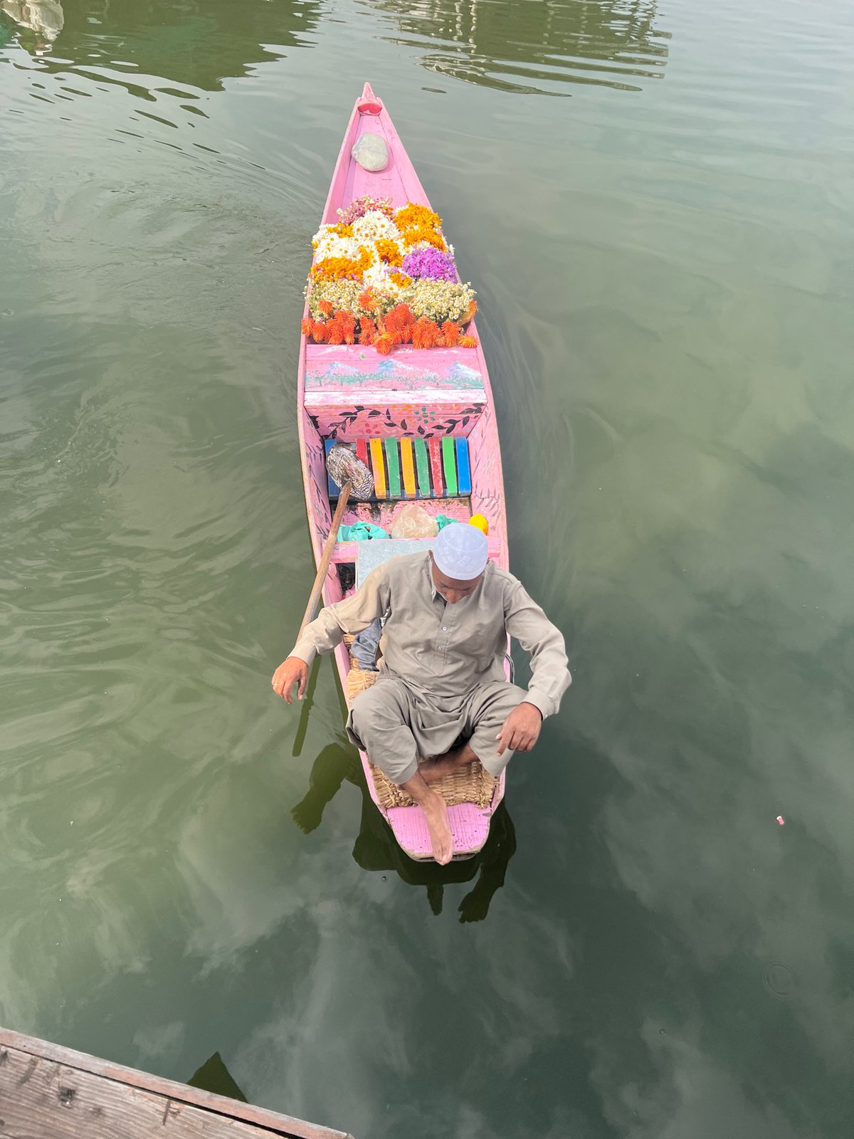 Quiet moment on a decorated pink shikara in Srinagar