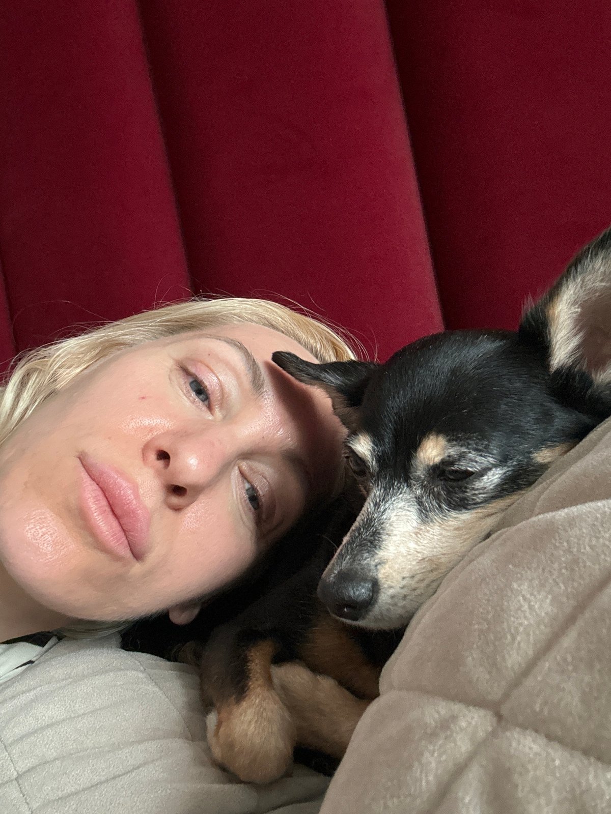Woman and small dog share quiet morning moments indoors