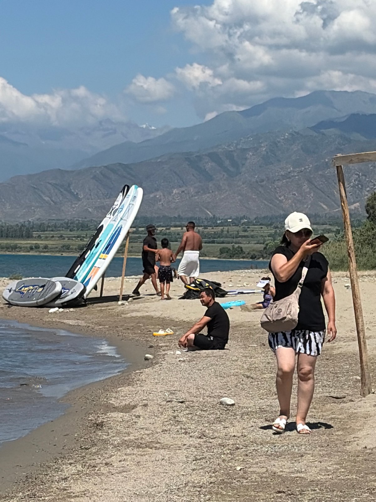 Paddleboarding and beach fun at a mountain lake