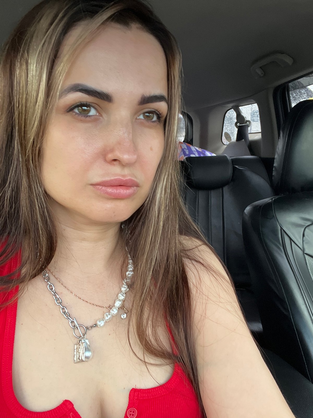Woman takes multiple selfies inside car during brief morning session