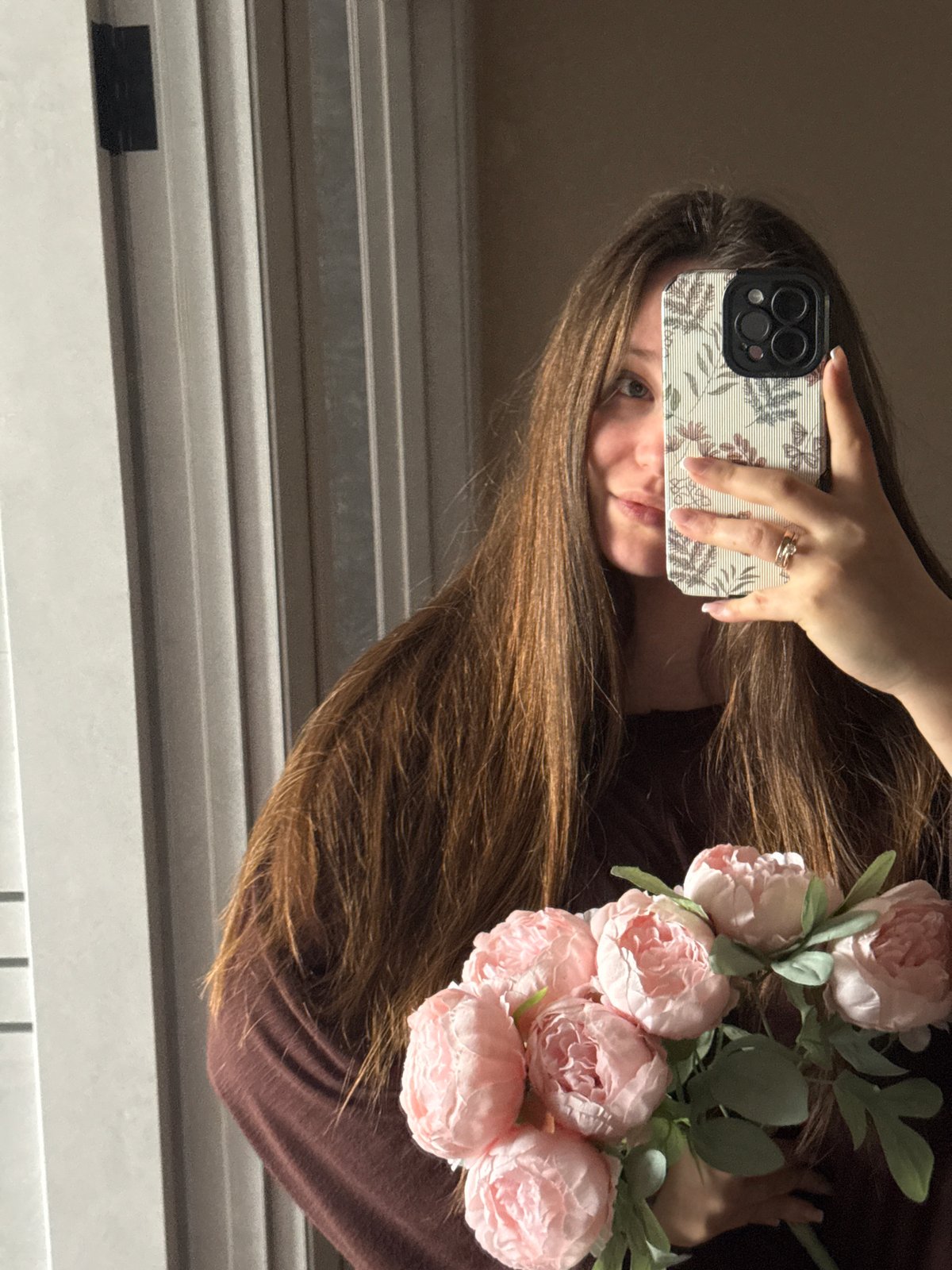 Woman takes mirror selfies in Krasnodar home Saturday morning