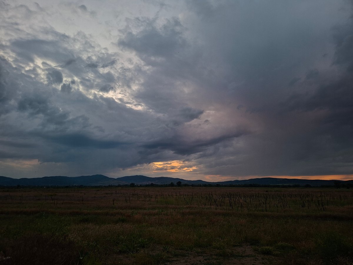 Evening documented in rural Bulgaria with beer and stormy skies