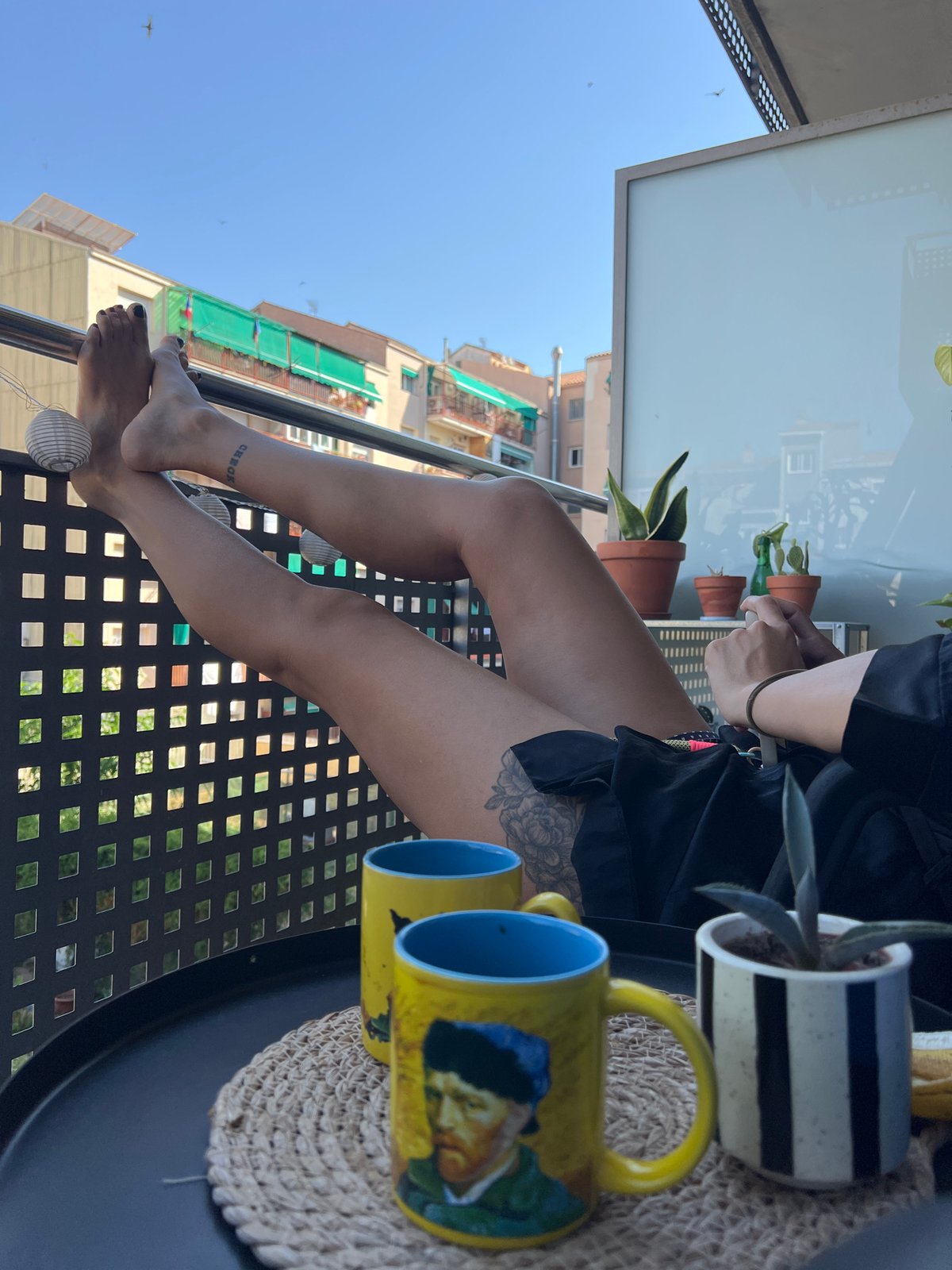 Feet up on a balcony railing in Mollet del Vallès